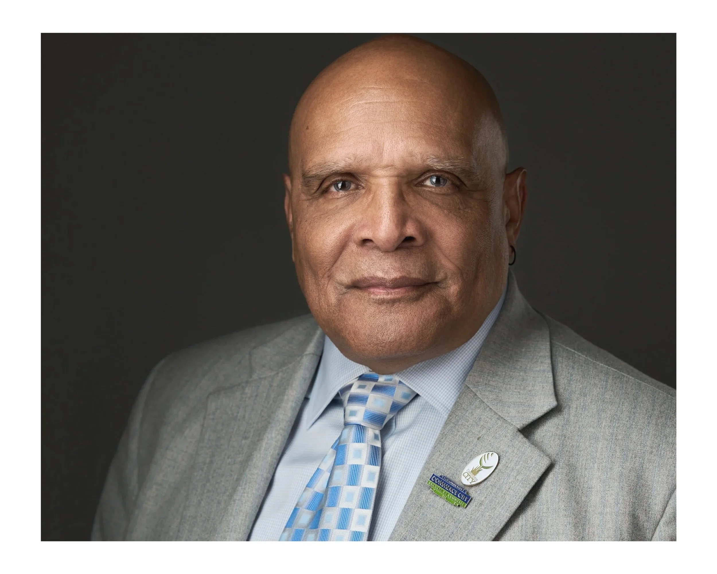 Professional headshot of man in a suit and tie in Aurora Colorado