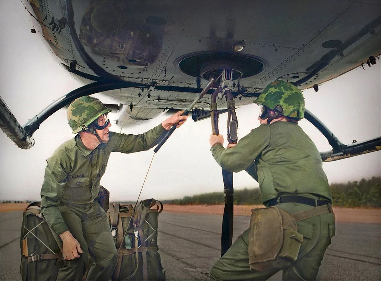 US Army Riggers attaching cargo to hovering helicopter - Fort Lee, Virginia 1980