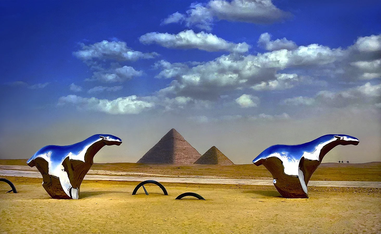 Stainless steel horses & wheels art exhibit at Pyramids - tribute to the chariots  -  Giza, Egypt 2024