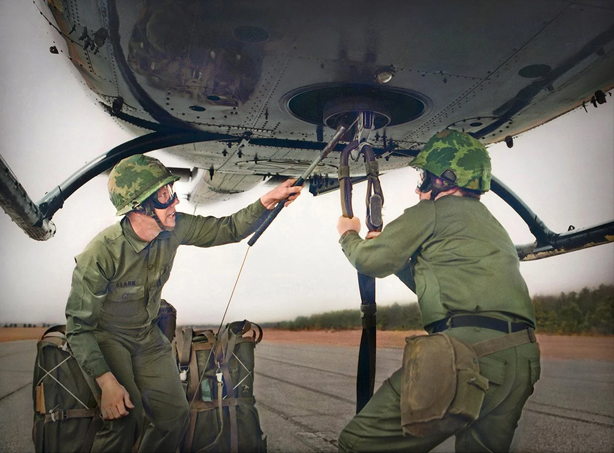 US Army Riggers attaching cargo to hovering helicopter - Fort Lee, Virginia 1980 - client: US Army