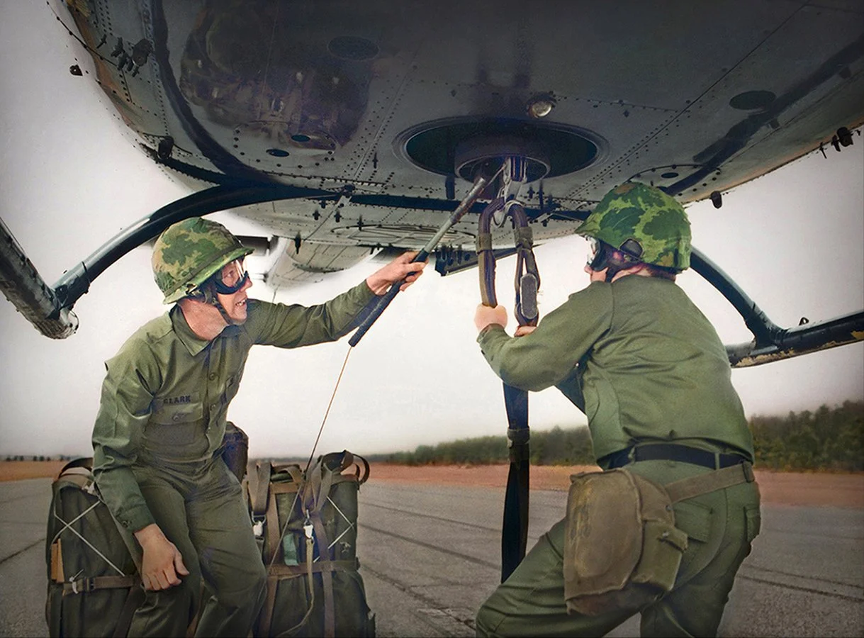 US Army Riggers hooking up cargo with hovering copter - Fort Lee, Virginia 1980 - client: US Army