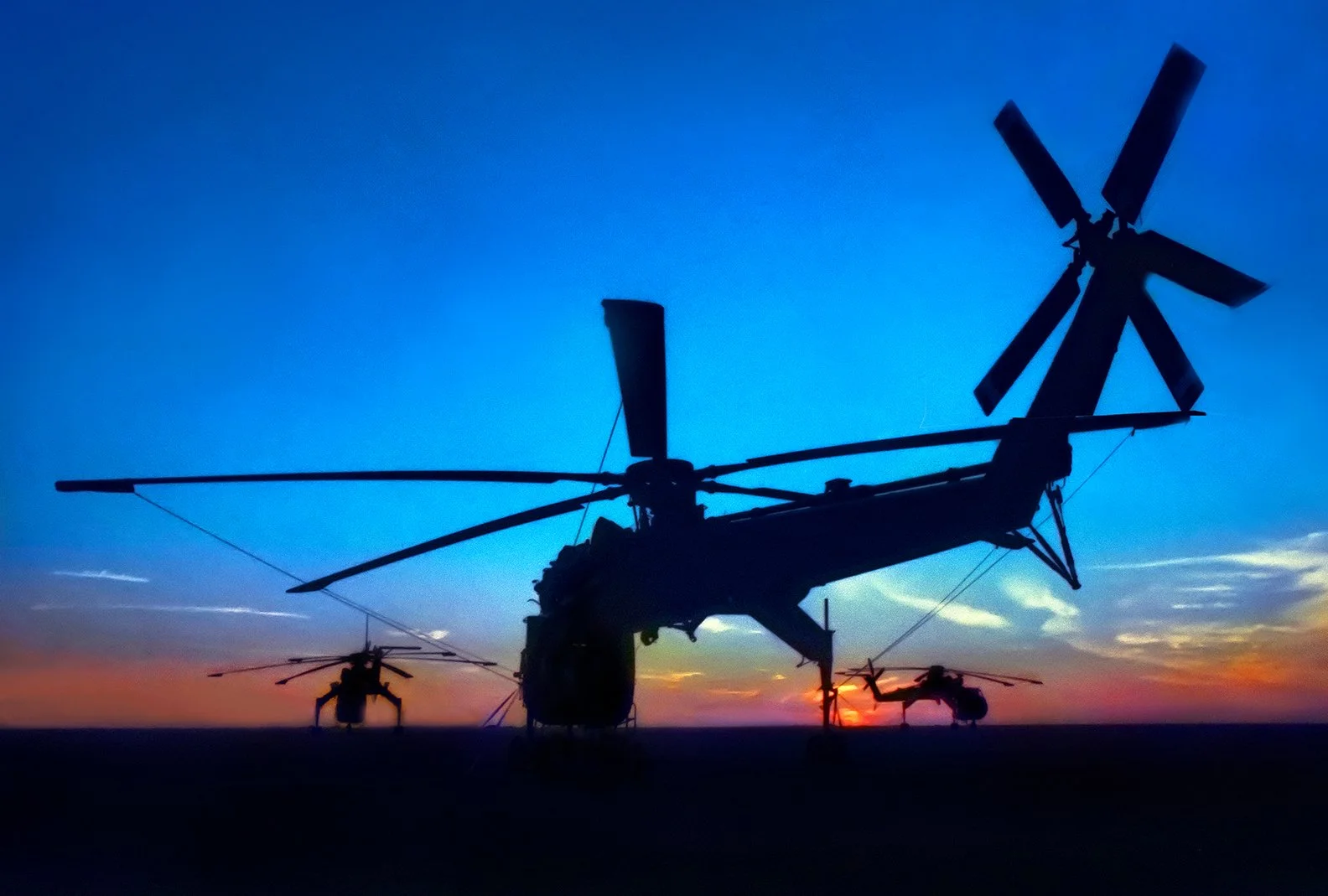 Sikorsky helicopters at sunset - US Army Riggers helicopter training base - Fort Lee, Virginia 1980   client: US Army