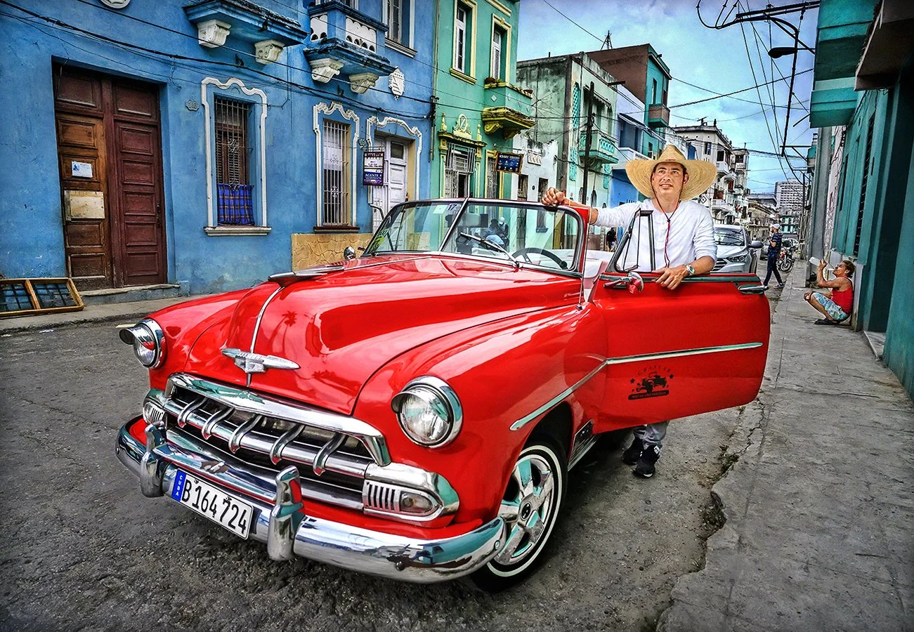 Ramses and his 1952 Red Chevy convertible taxi - Habana, Cuba 2019