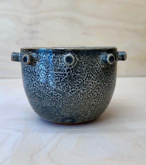 grey vessel with attachments