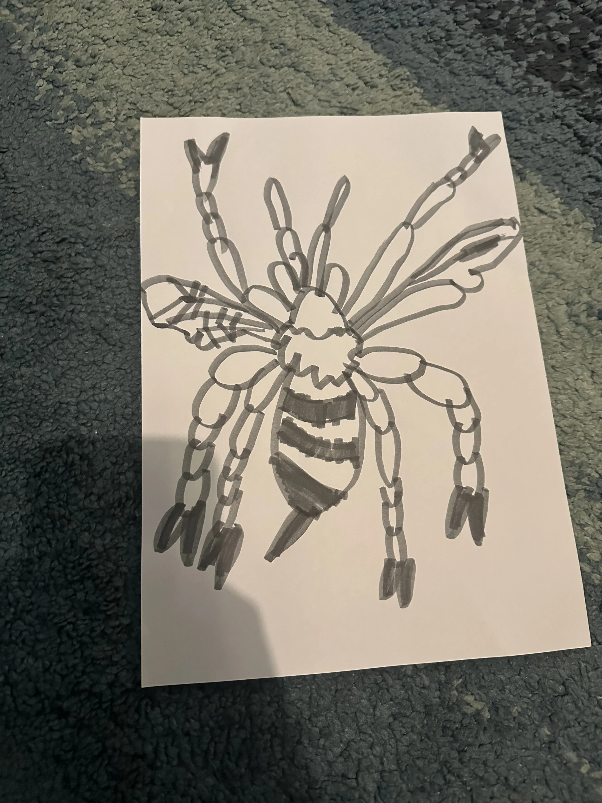 child of gentle parenting draws a bee picture