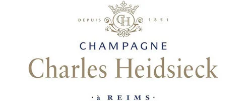 Label for Charles Heidsieck Champagne with gold and blue text, crown logo, and decorative elements.
