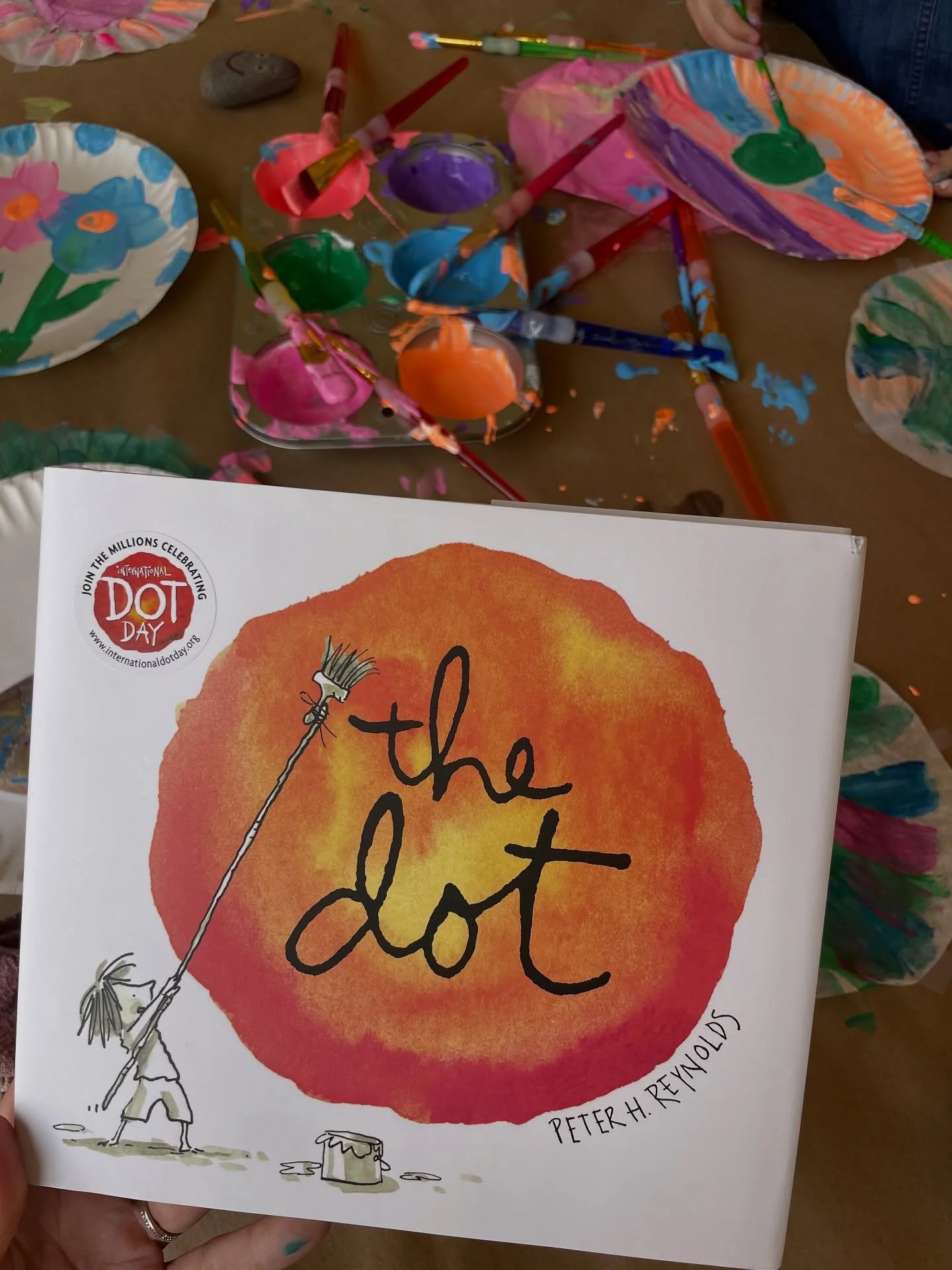 Dot Day is a celebration of creativity, courage, and collaboration, inspired by The Dot, a classic! We celebrated all day long with ages 3-13 👩🏽&zwj;🎨🎨🌈😍✨

A dot wall, a dot inspired sensory tray, creative play with recycled bottle caps, creati