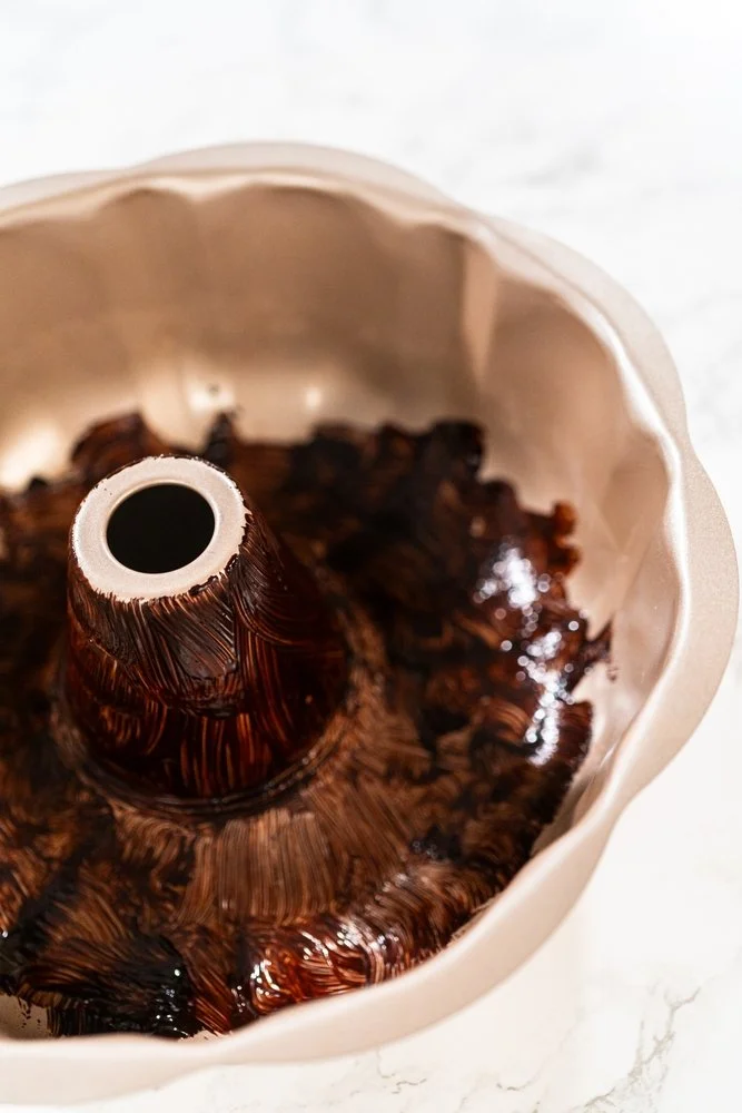 Bundt Pan Lined with Melted Butter and Cocoa Powder