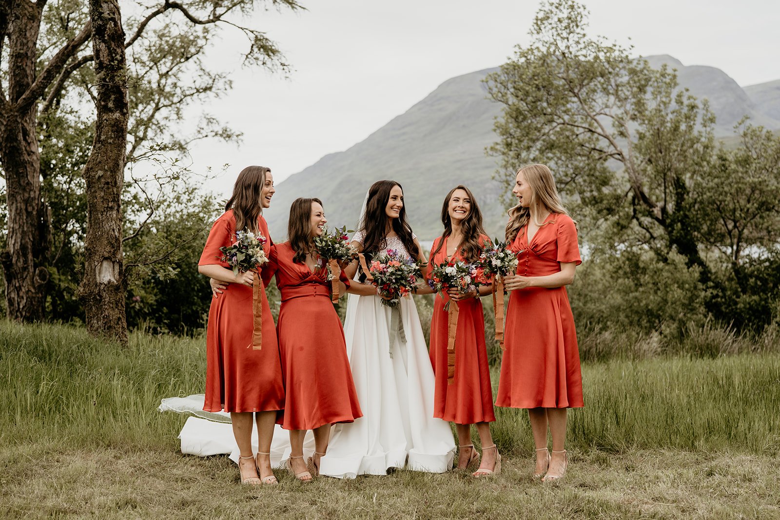 Wild feather and event styling rust bridesmaids.jpg