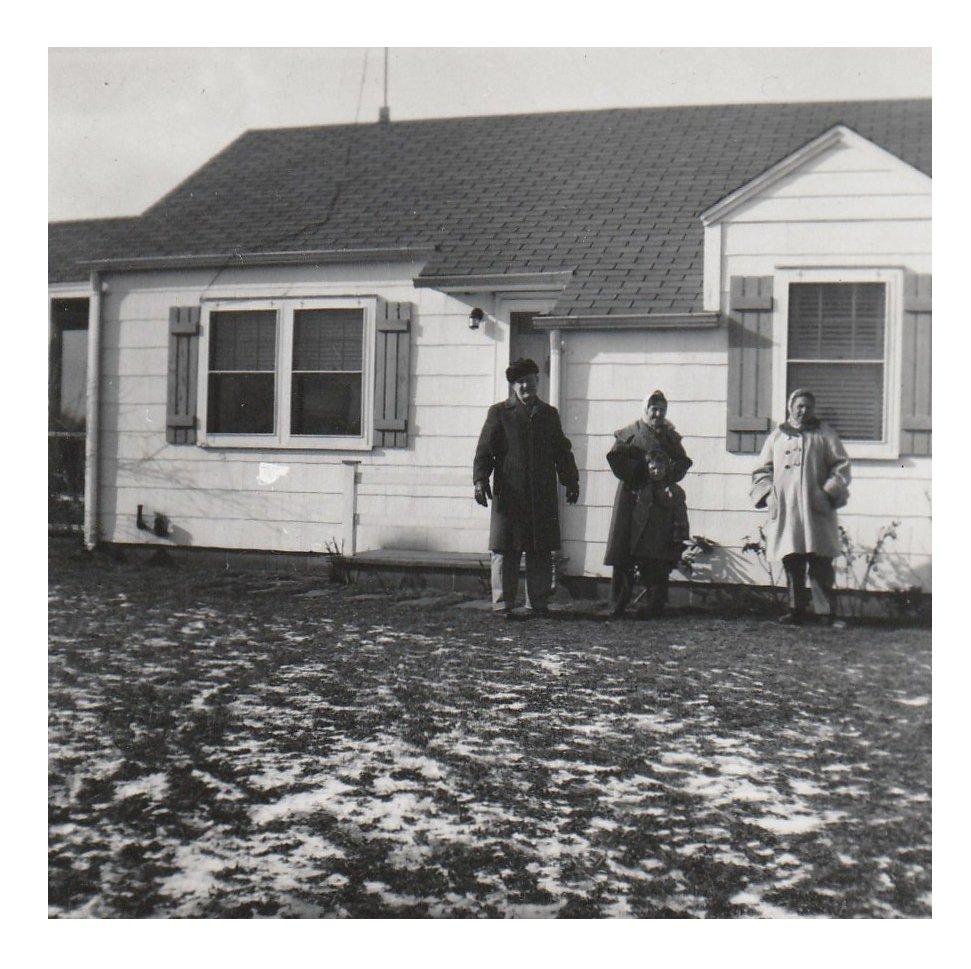 Family in front of their house on Woodacres.