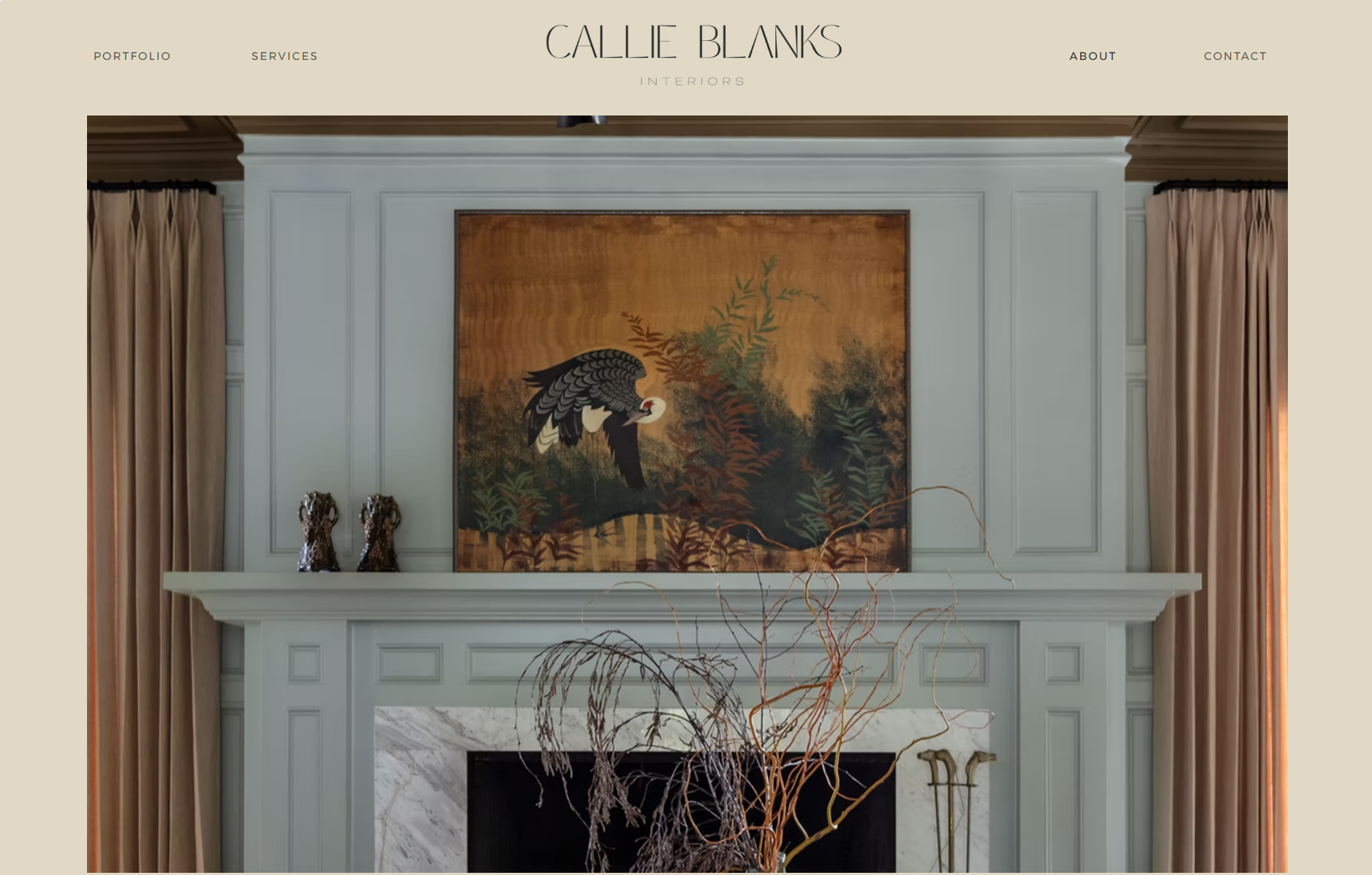 Living room fireplace with a large framed painting of a bird and greenery on the mantle, flanked by beige curtains and decorative items.