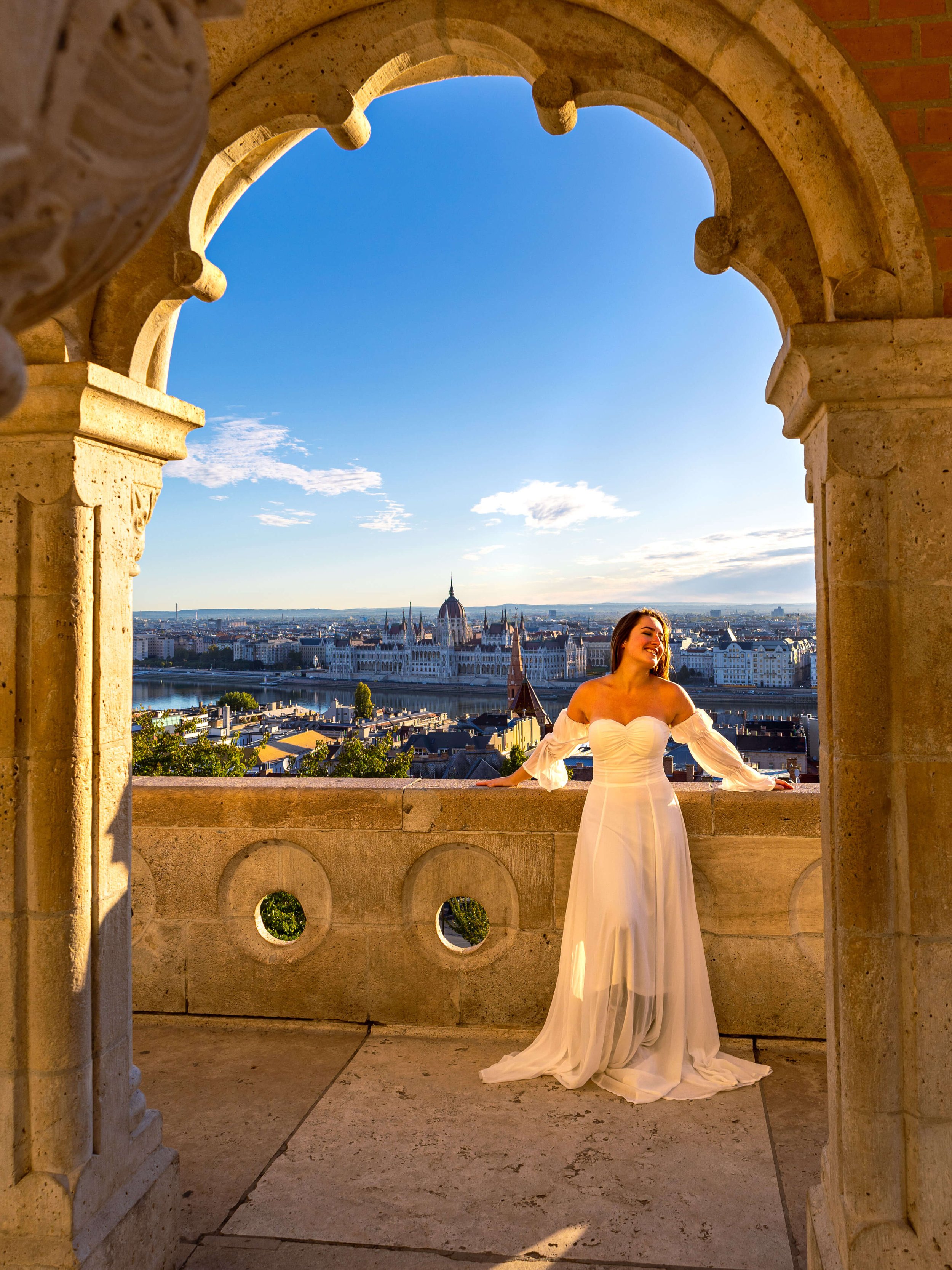 woman on balcony at fishermans bastion overlooking danube budapest hungary.jpg