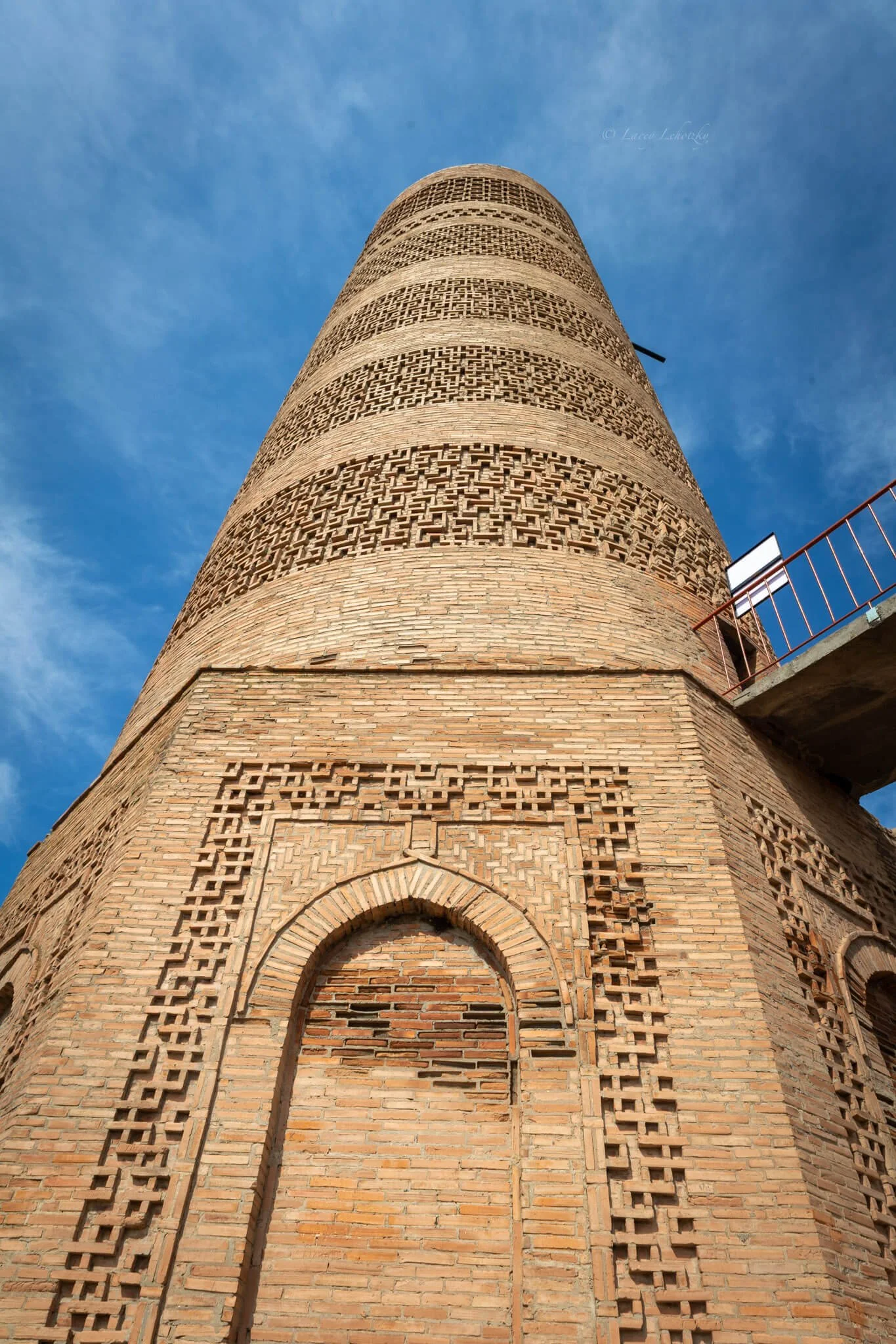 an ancient minaret from the silk road stands tall against a bright blue sky burana tower kyrgyzstan