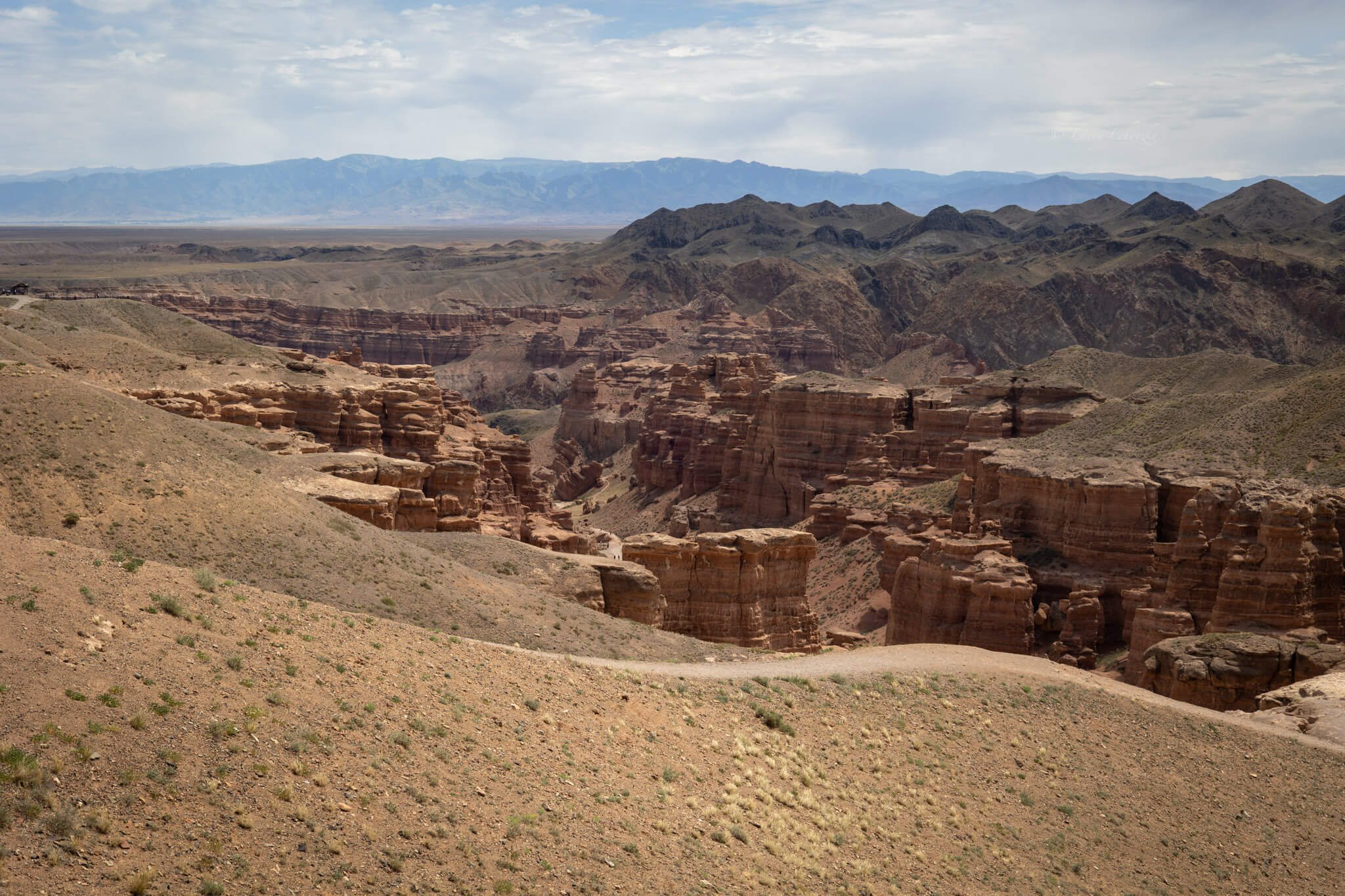 a deep canyon disappears into the distance, vast and deep among the desert red rocks charyn canyon kazakhstan