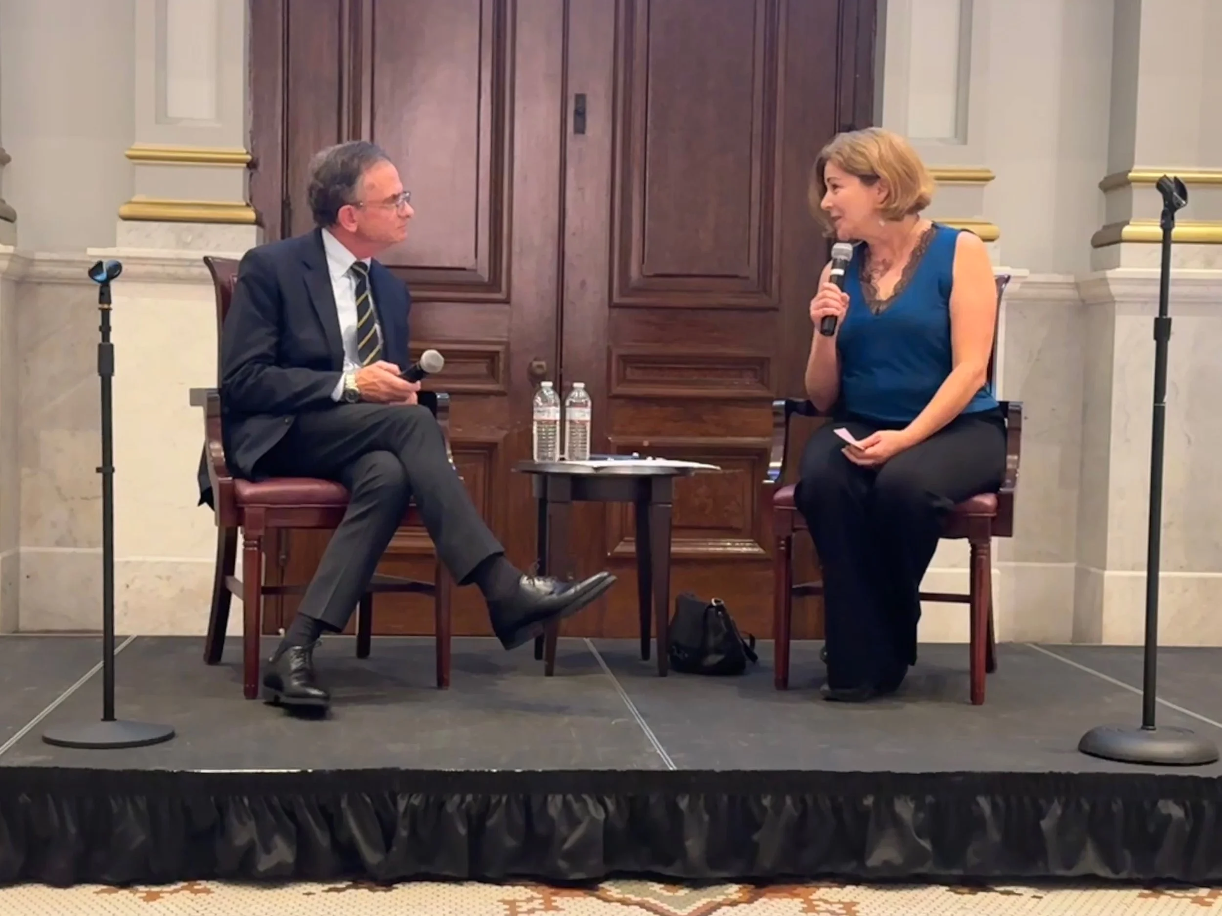 Host Maiken Scott (right) and speaker, Dan Weiss (left) in discussion at the October 2026 event.