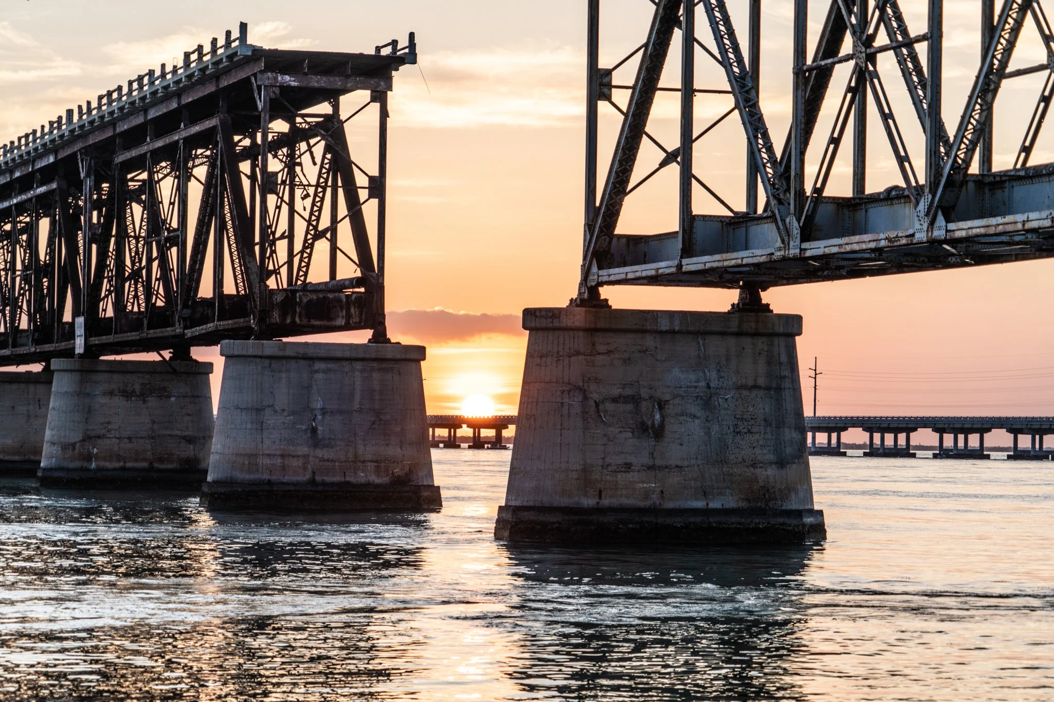 Coastal Vibes limited edition fine art photograph by Jason Sponseller, featuring Bahia Honda Bridge in the Florida Keys at sunrise with steel trusses, ocean water, and warm coastal light
