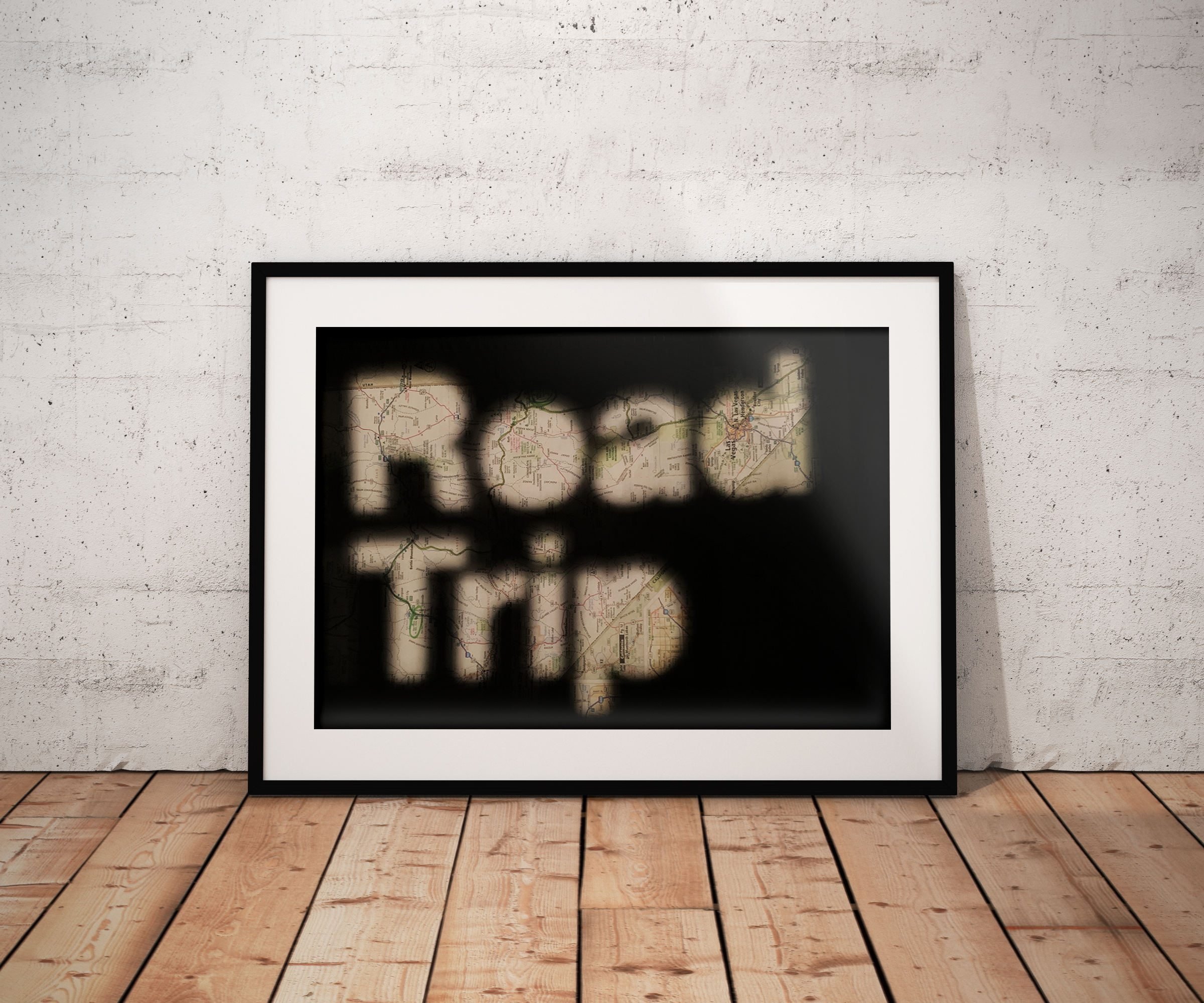 This poster was created purely by physical manipulation. The letters were cut out of matboard, and a light was projected through the letterforms onto a road map.