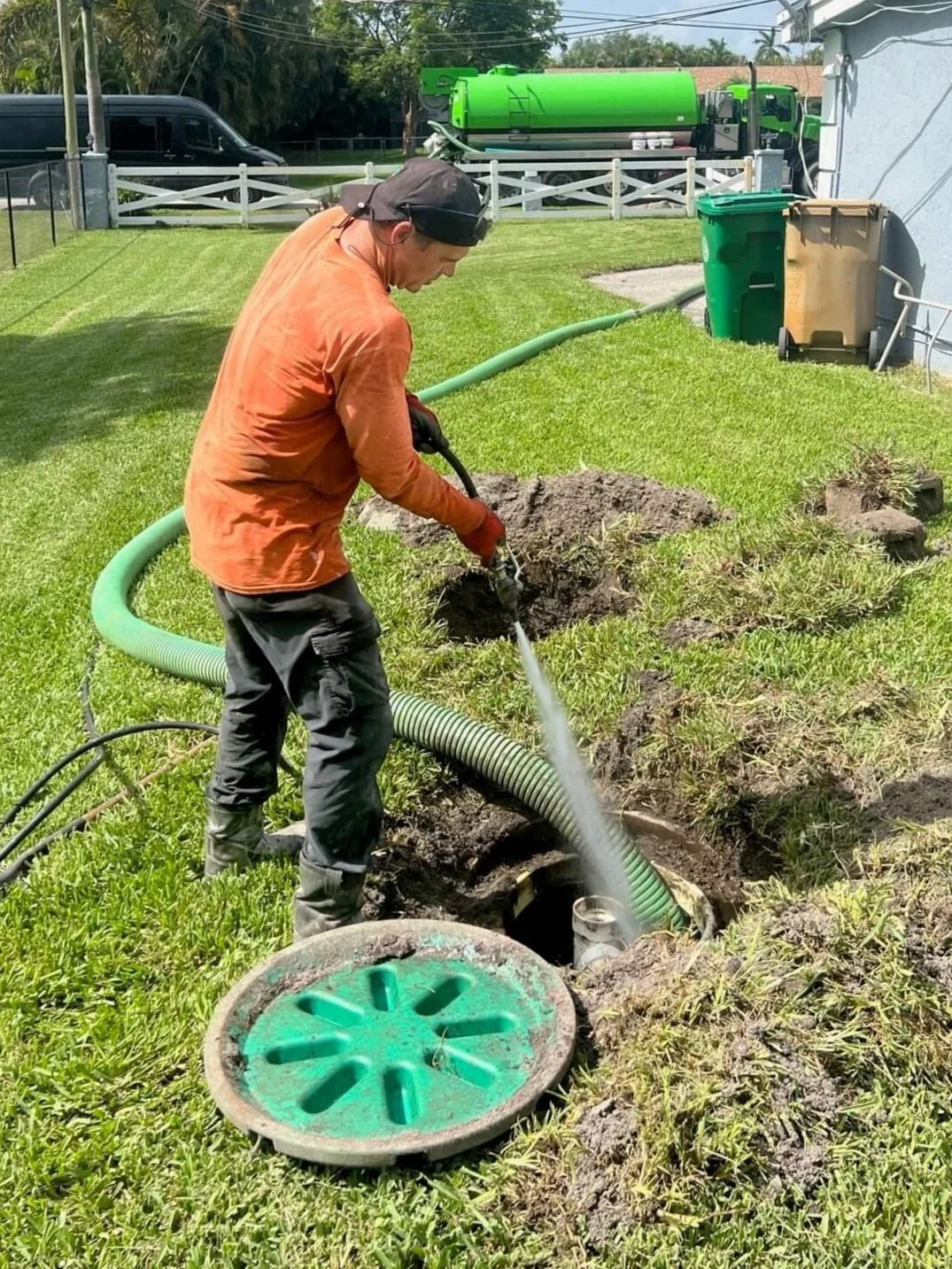 a proper septic tank cleaning in west broward county, fl both lids open pressure washing tank