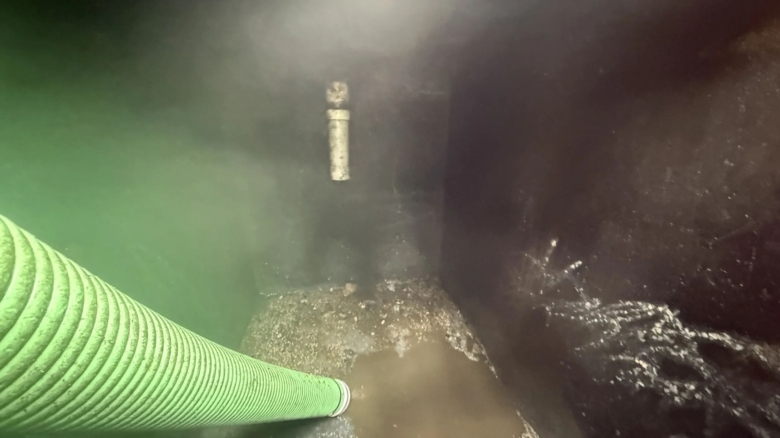 bottom of septic tank with sludge removed