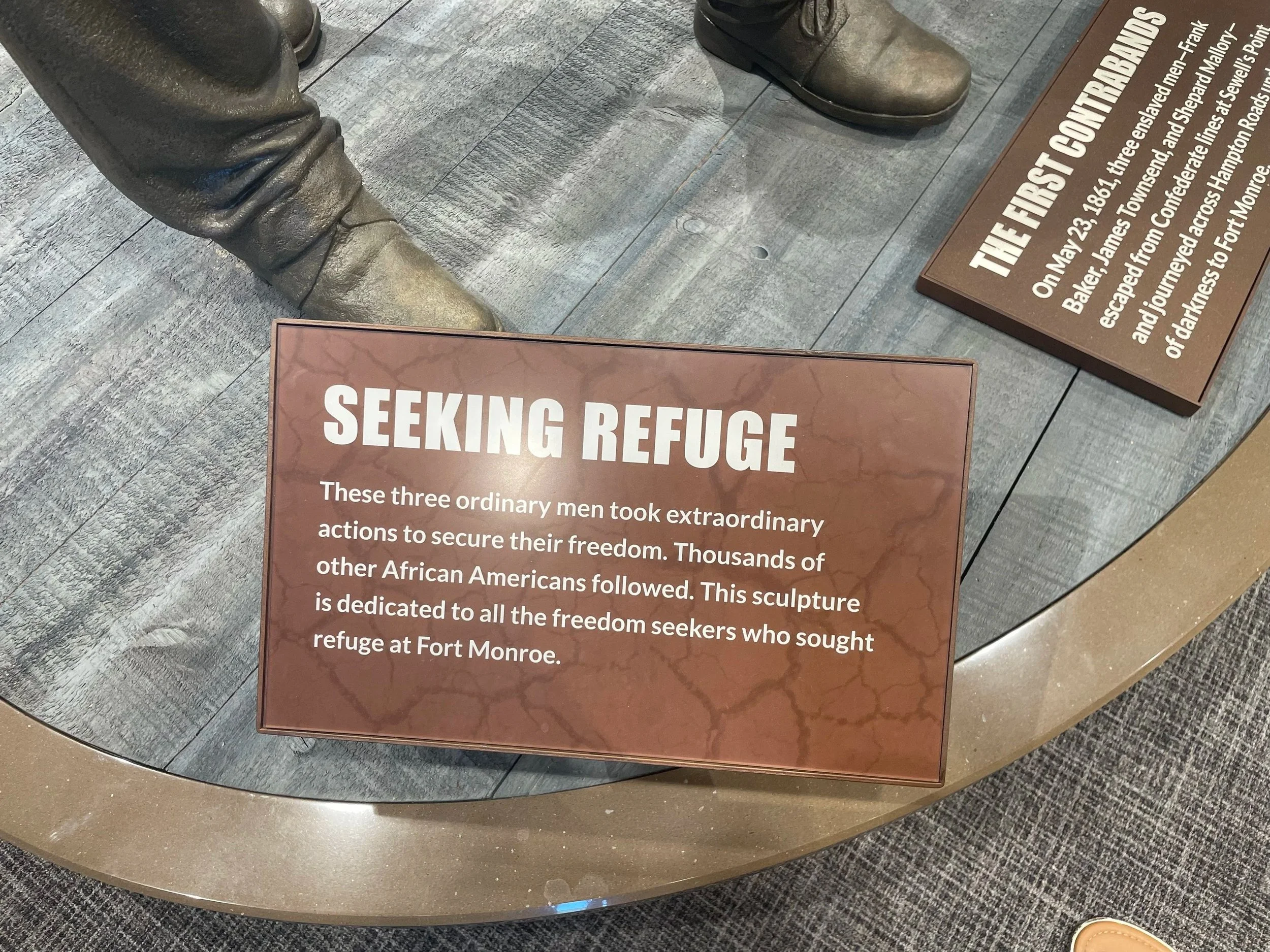 Seeking Refuge: "These three ordinary men took extraordinary actions to secure their freedom. Thousands of other African Americans followed. This sculpture is dedicated to all the freedom seekers who sought refuge at Fort Monroe."