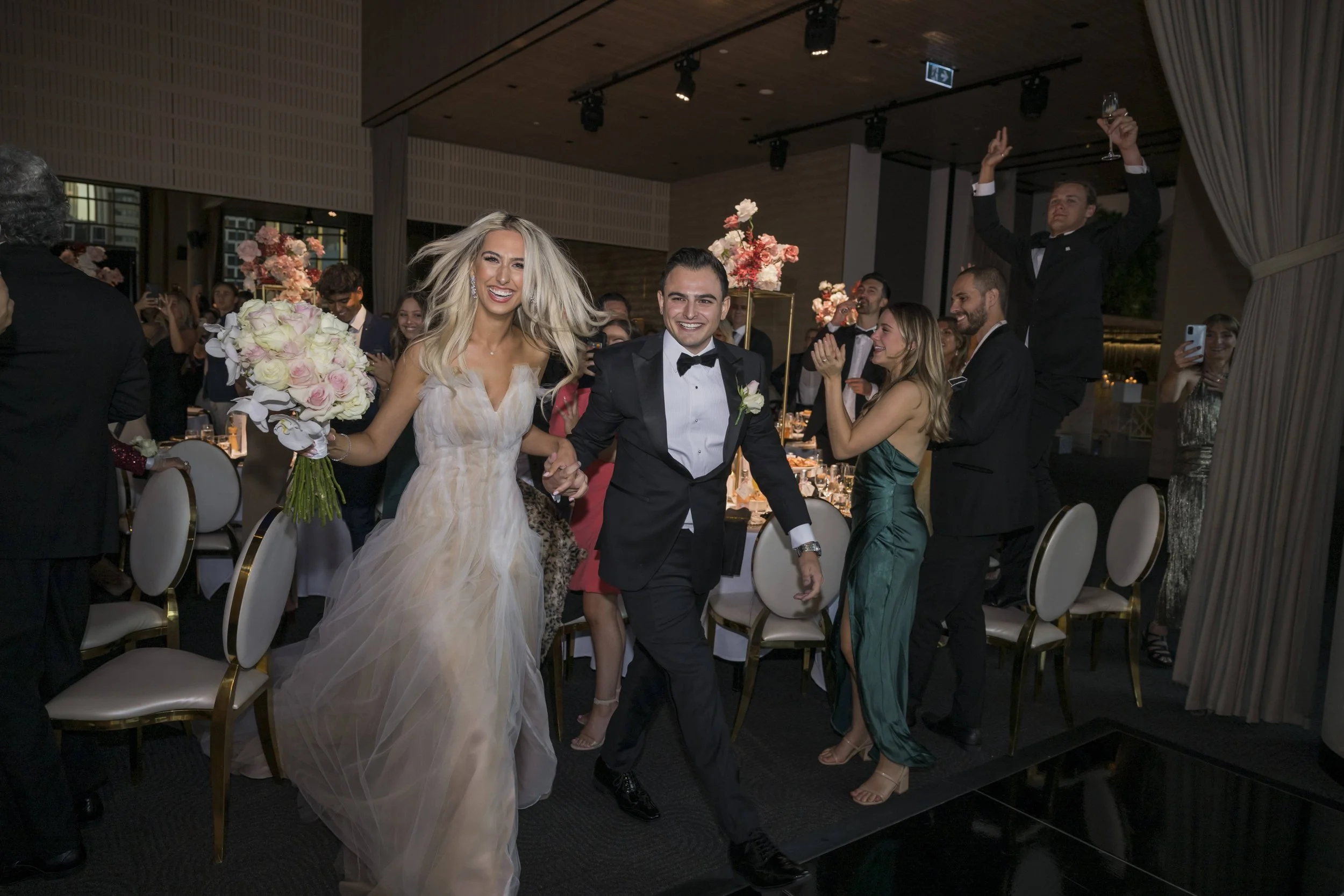 This image showcases bride and groom's wedding entrance at Metropolis Events in Melbourne