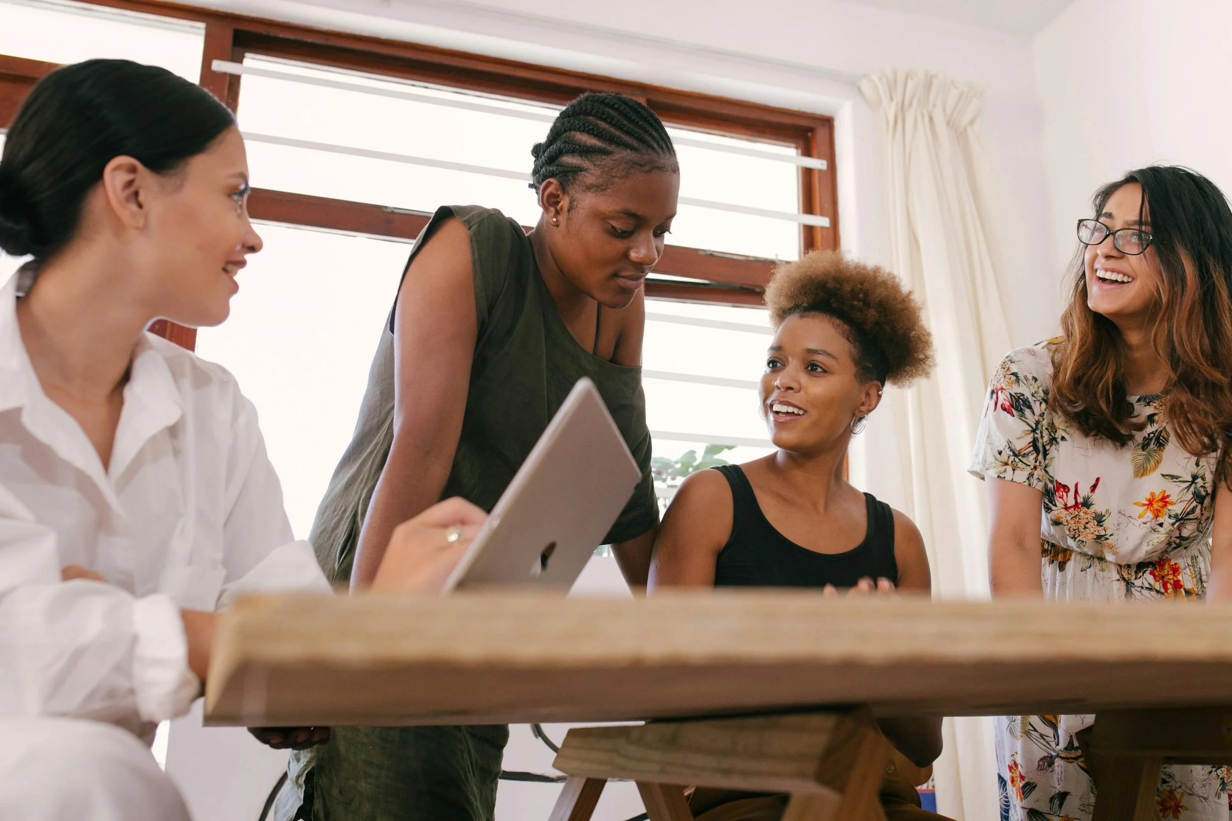 A stock photo of a group of women chatting.