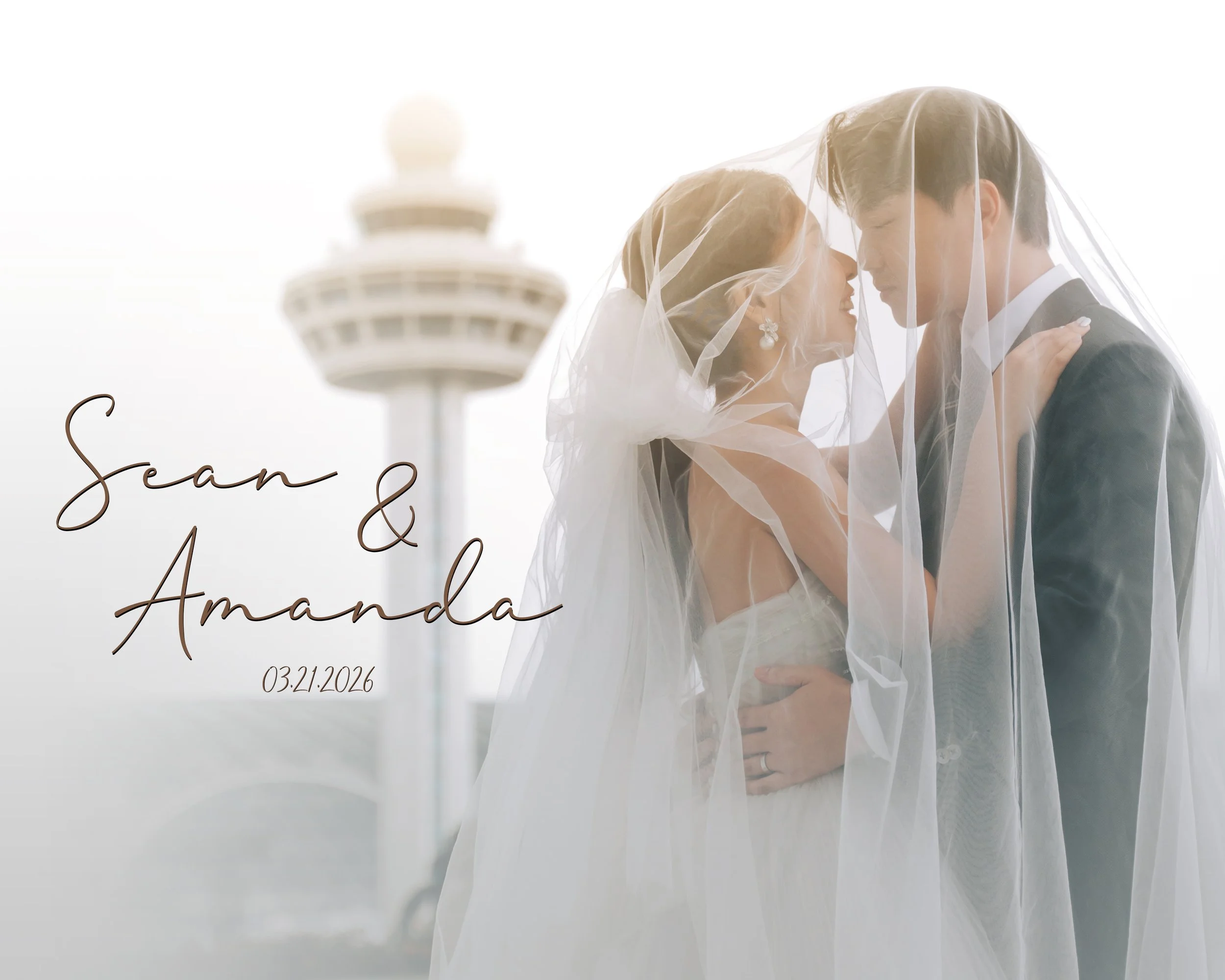 A bride and groom under a wedding veil, standing close together on a bridge with the Space Needle in the background, during a wedding photo shoot.