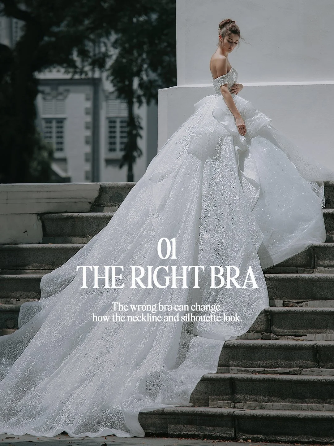Bride in an off-shoulder ball gown with a long train on stone steps, wearing the right bra for a gown fitting