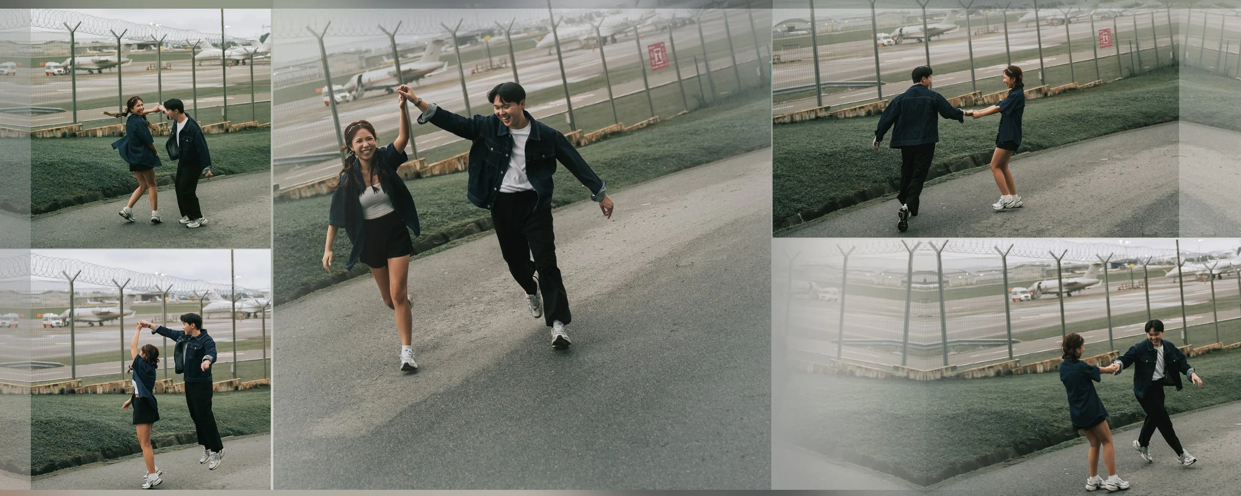 Two young people dancing and holding hands at an airport fence, with airplanes in the background.