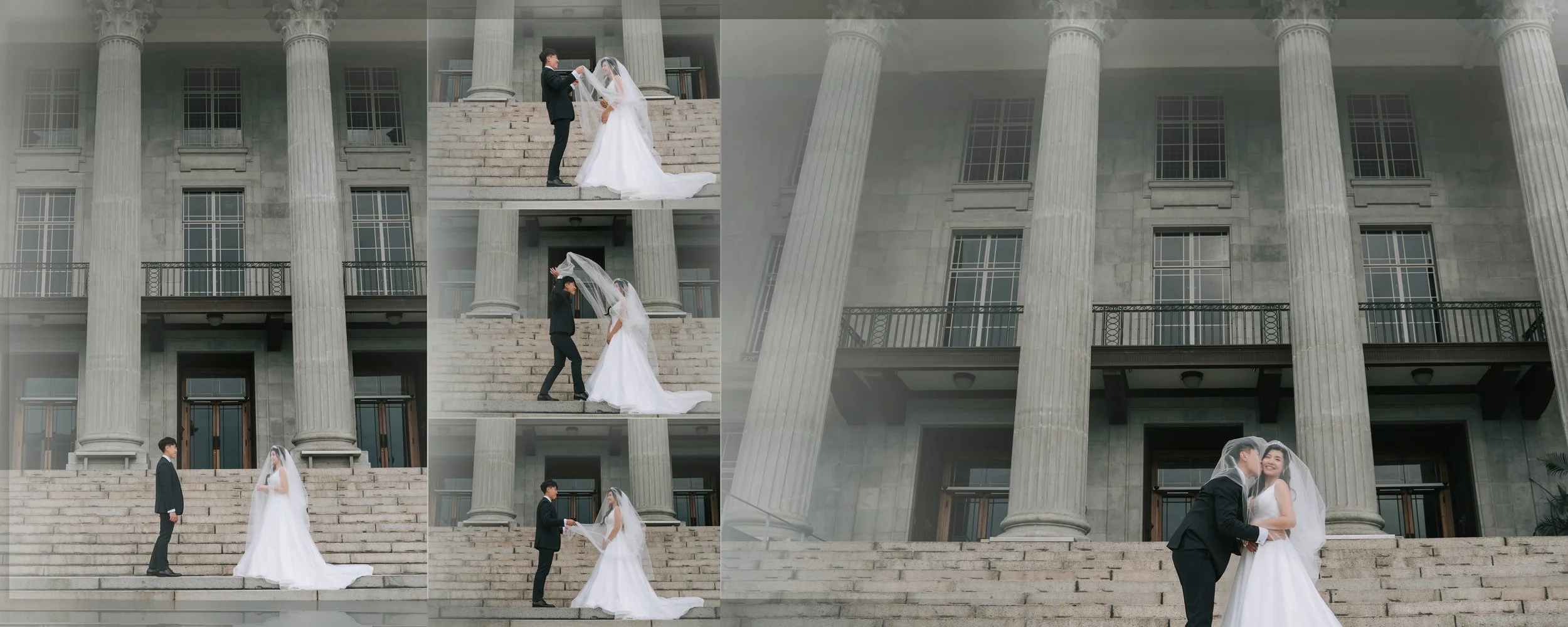 A wedding scene on the steps of a large gray stone building with tall columns, featuring a bride and groom. The bride is wearing a white wedding dress with a veil, and the groom is dressed in a black tuxedo. They are exchanging rings, sharing a kiss,