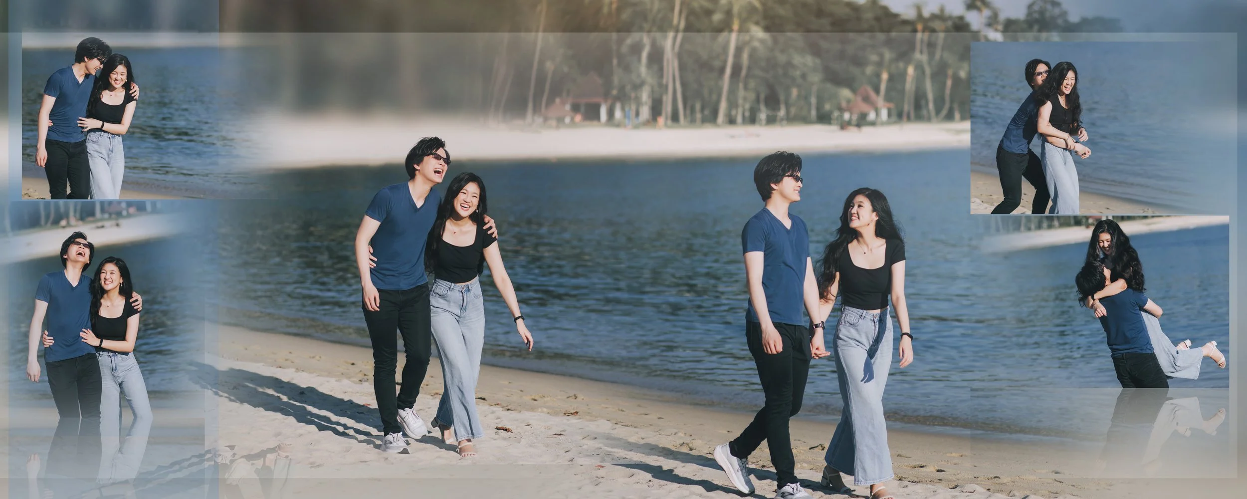 A group of five young adults, two men and three women, walking and laughing on a sandy beach near a lake, with trees and houses in the background.