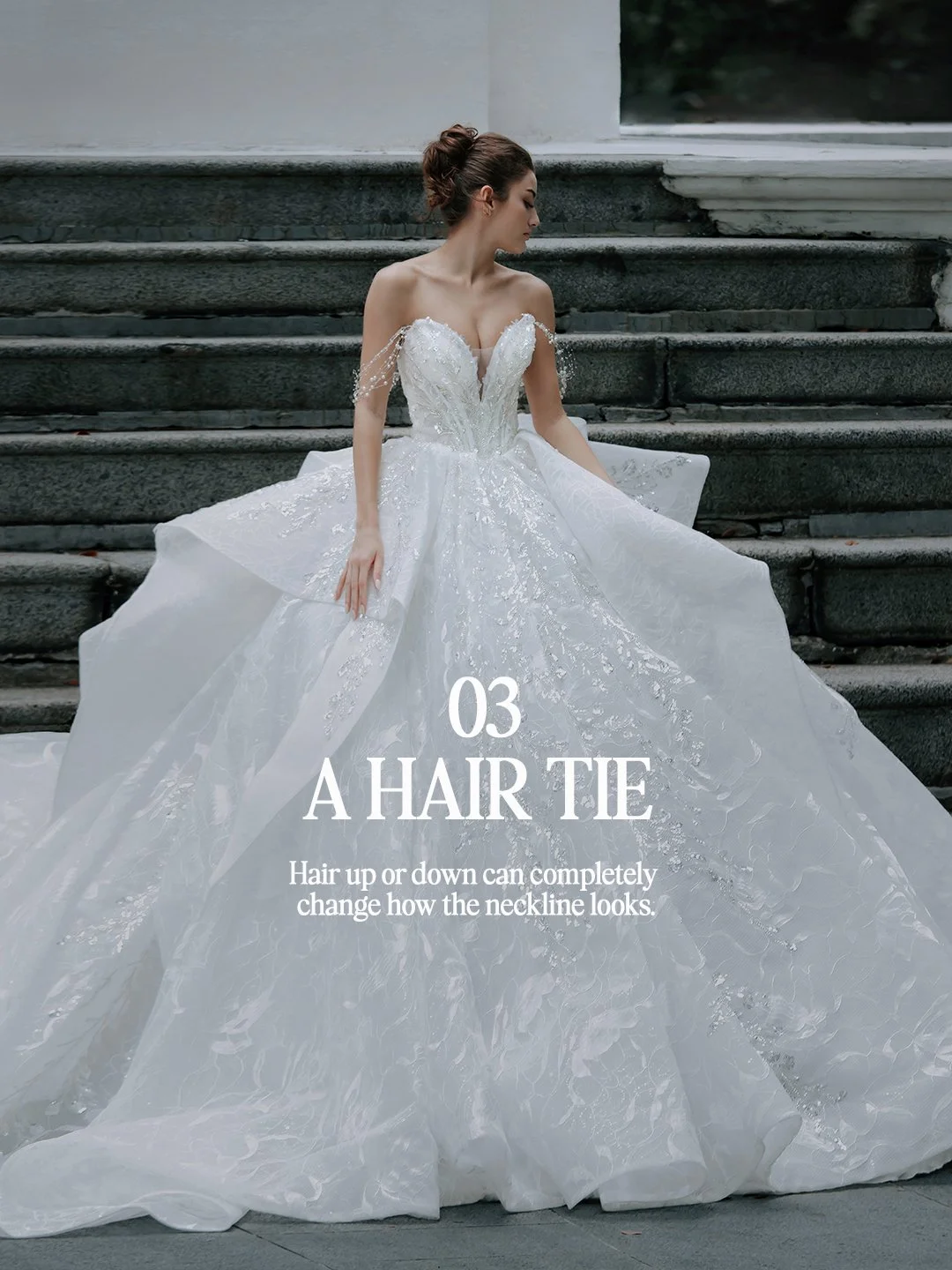 Bride with hair in an updo wearing a sweetheart ball gown with beaded drape sleeves