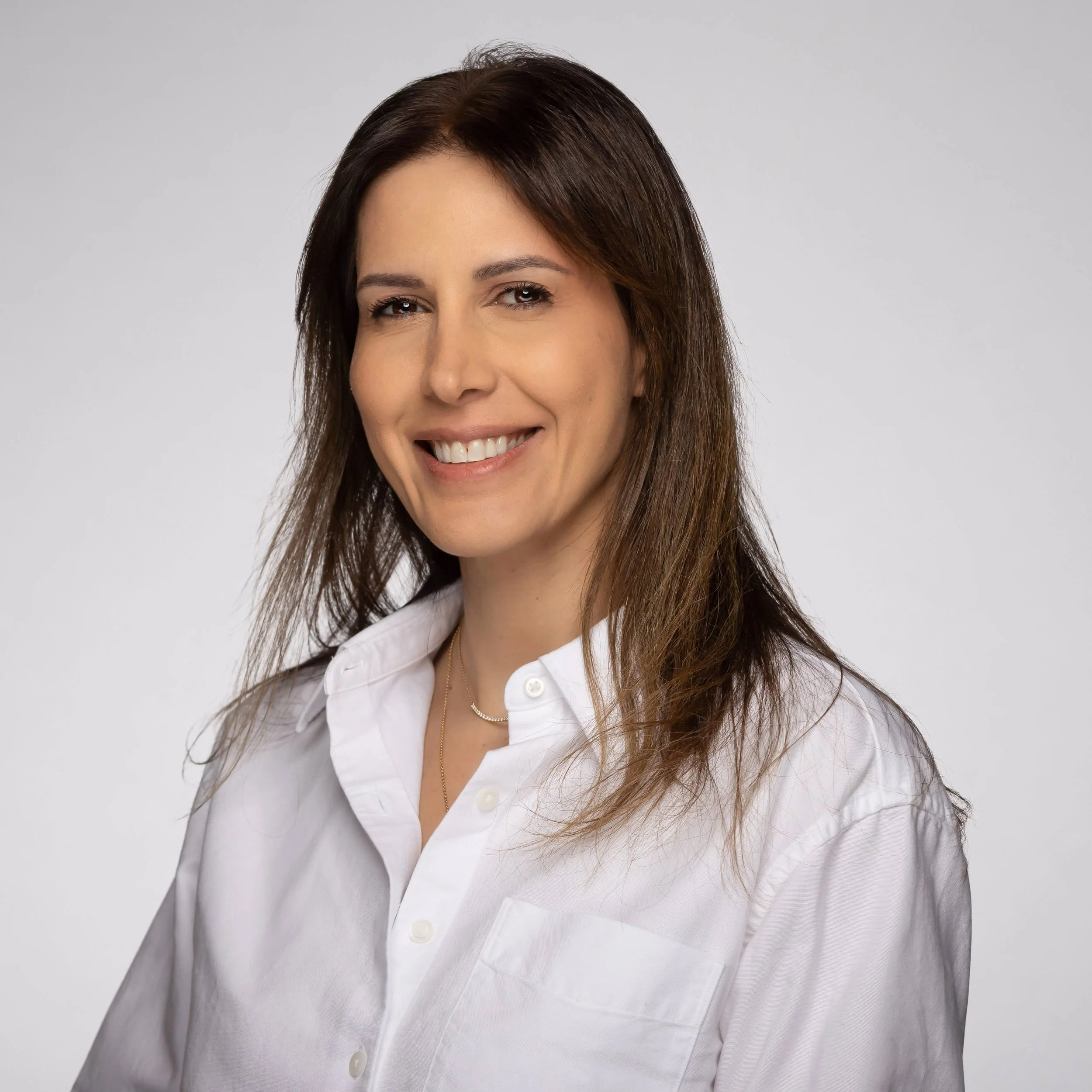 Gretta Eid en veston gris