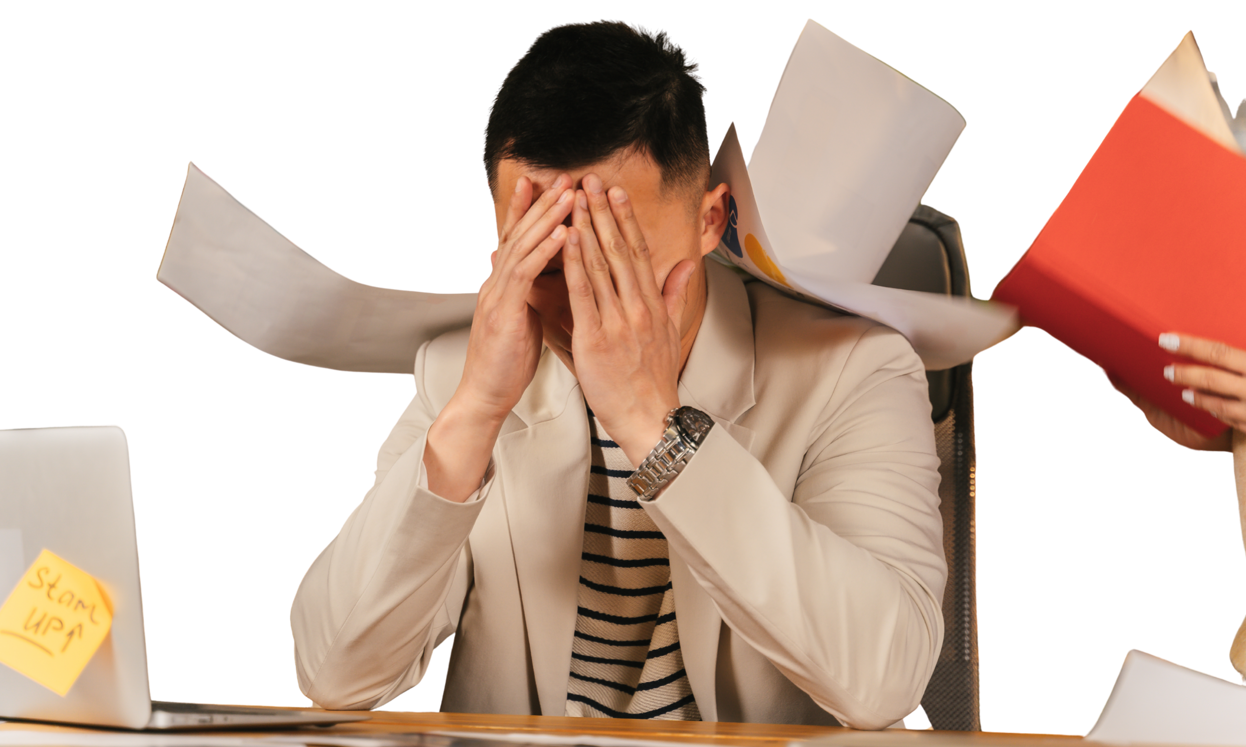A stressed man sits at a cluttered desk with papers flying around, covering his face with his hands, while someone hands him a red folder. A laptop with a sticky note saying 'Stressed UP' is on the desk.