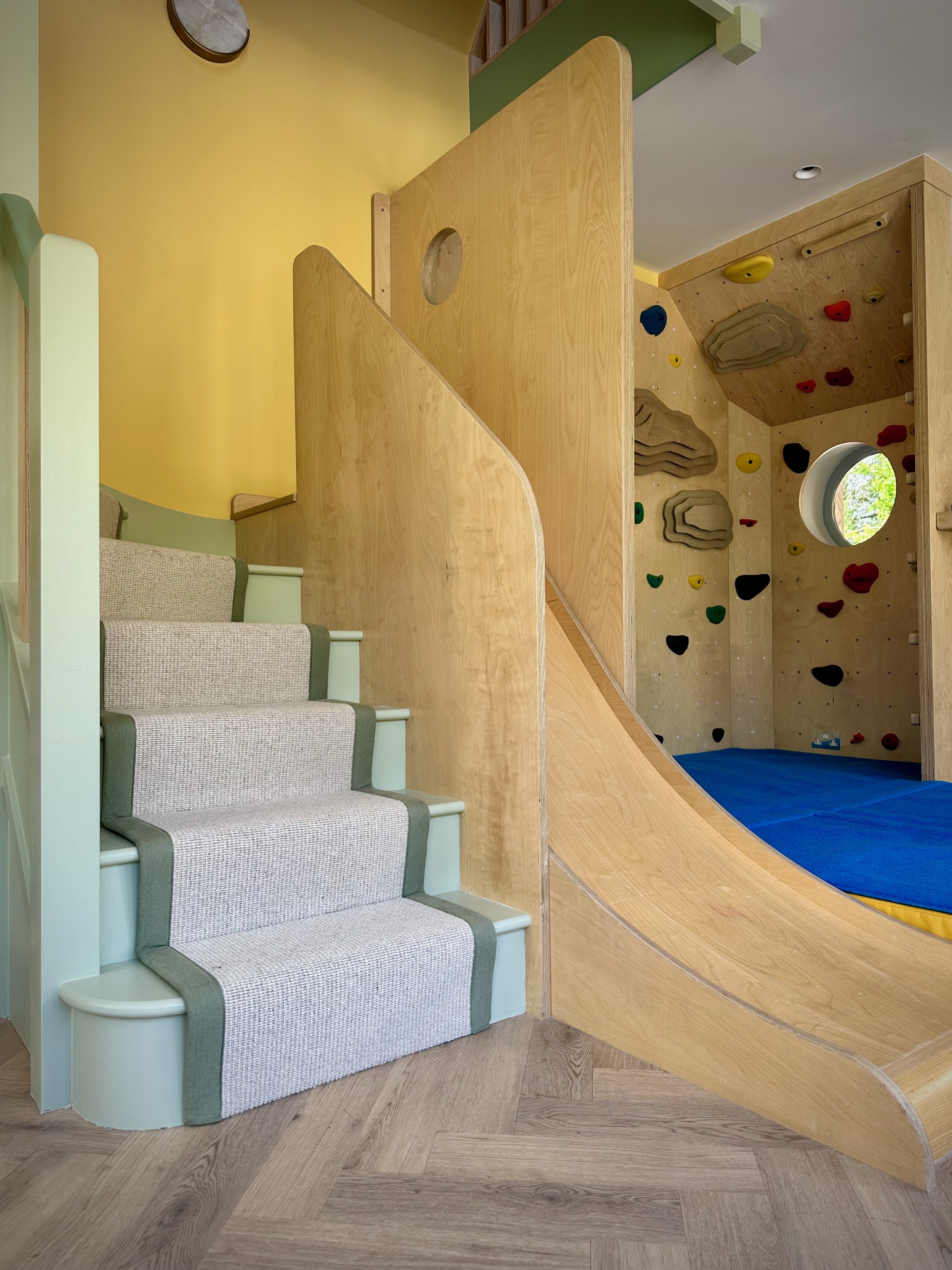 custom playroom staircase with slide 
