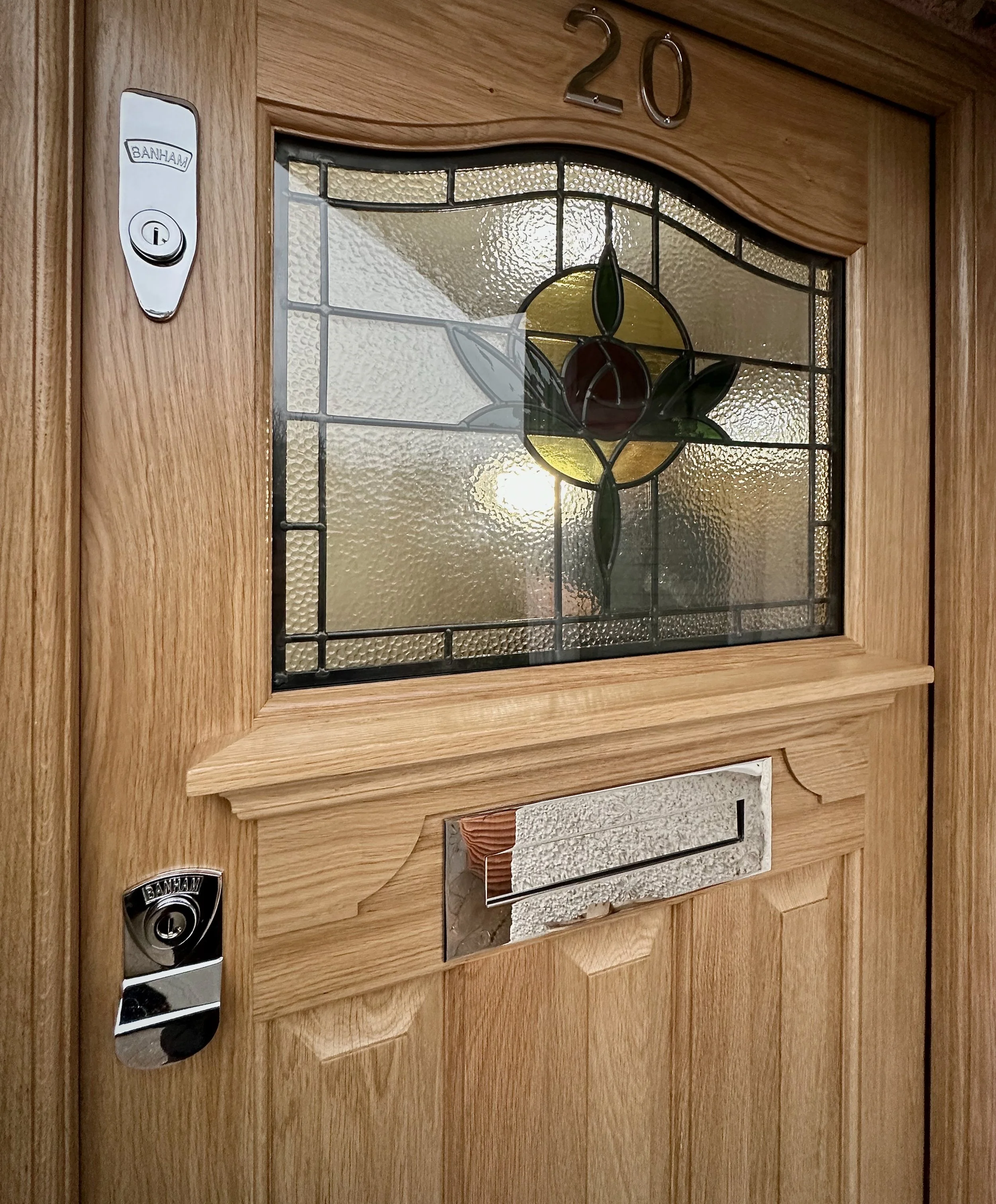 Bespoke oak front door with stained glass