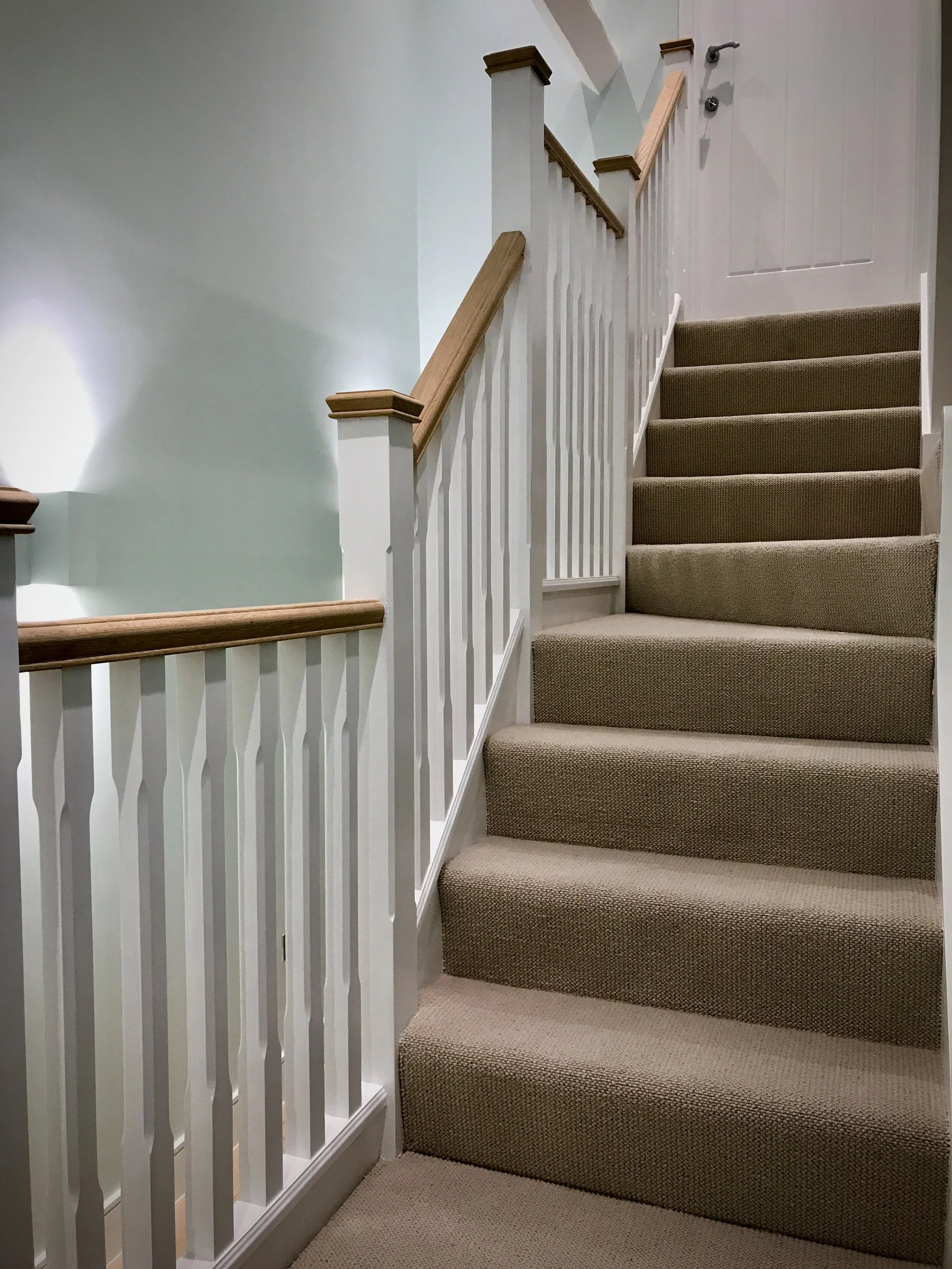 Traditional split level staircase with oak balustrades Oxfordshire 