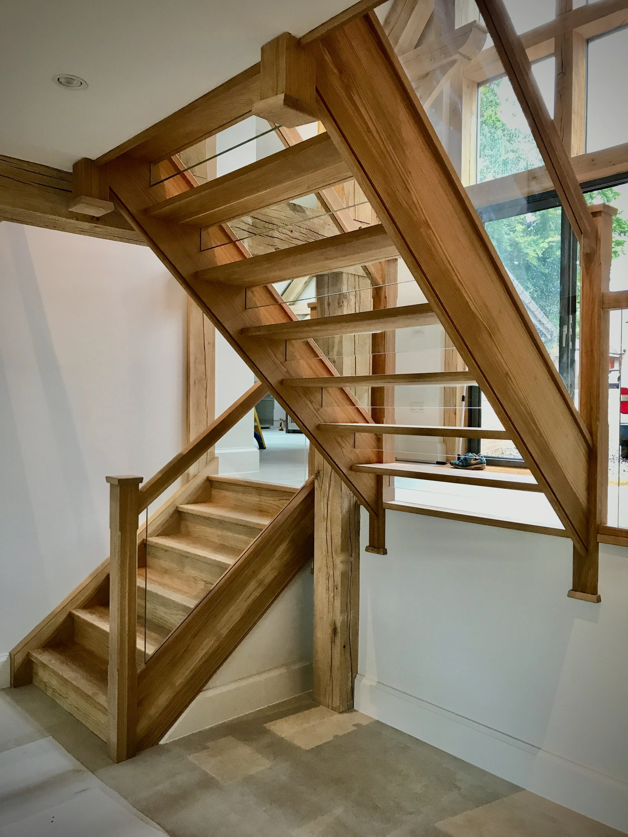Oak open-riser staircase with glass balustrades  Berkshire 