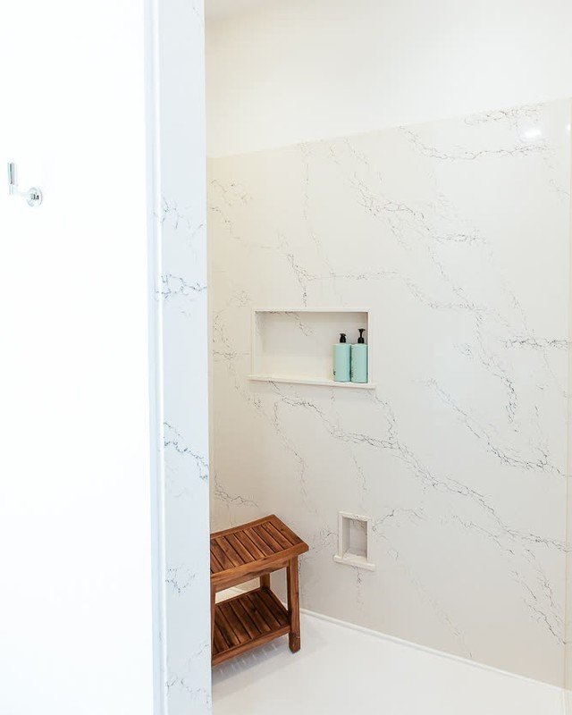 Say goodbye to grout lines! 👋✨
This custom shower features sleek quartz slabs for a seamless, low-maintenance look that's as stunning as it is practical. With fewer joints and bold, clean lines, it's a modern upgrade that brings spa vibes home. 🚿 
