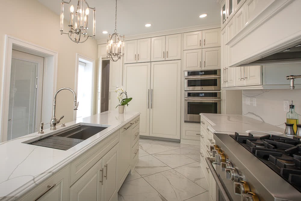 Now you see it... now you don't 👀✨
This kitchen is full of secrets &mdash; with a paneled fridge, a disguised dishwasher, and a seamless walk-through pantry cabinet that blends right in. Clean lines, clever design, and nothing out of place! 🍽️ 

#K