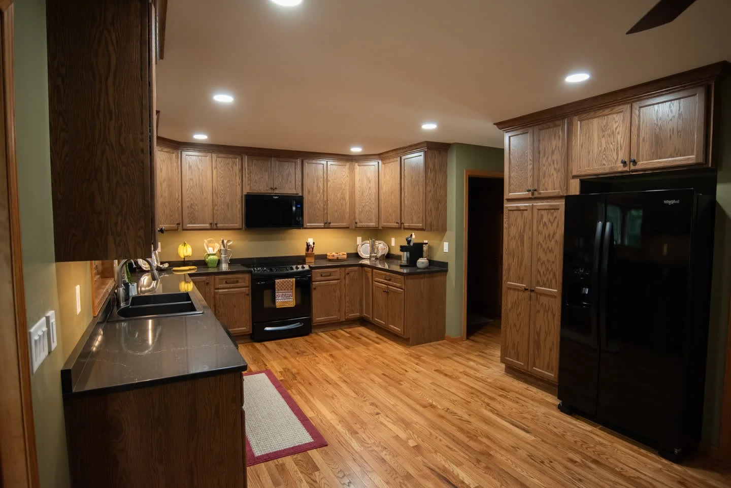✨ Project Reveal ✨
This kitchen received a stunning transformation! We updated the cabinets to a warm medium oak, upgraded the countertops from laminate to Cambria Charlestown quartz, and removed the soffits to create more height and openness. To max