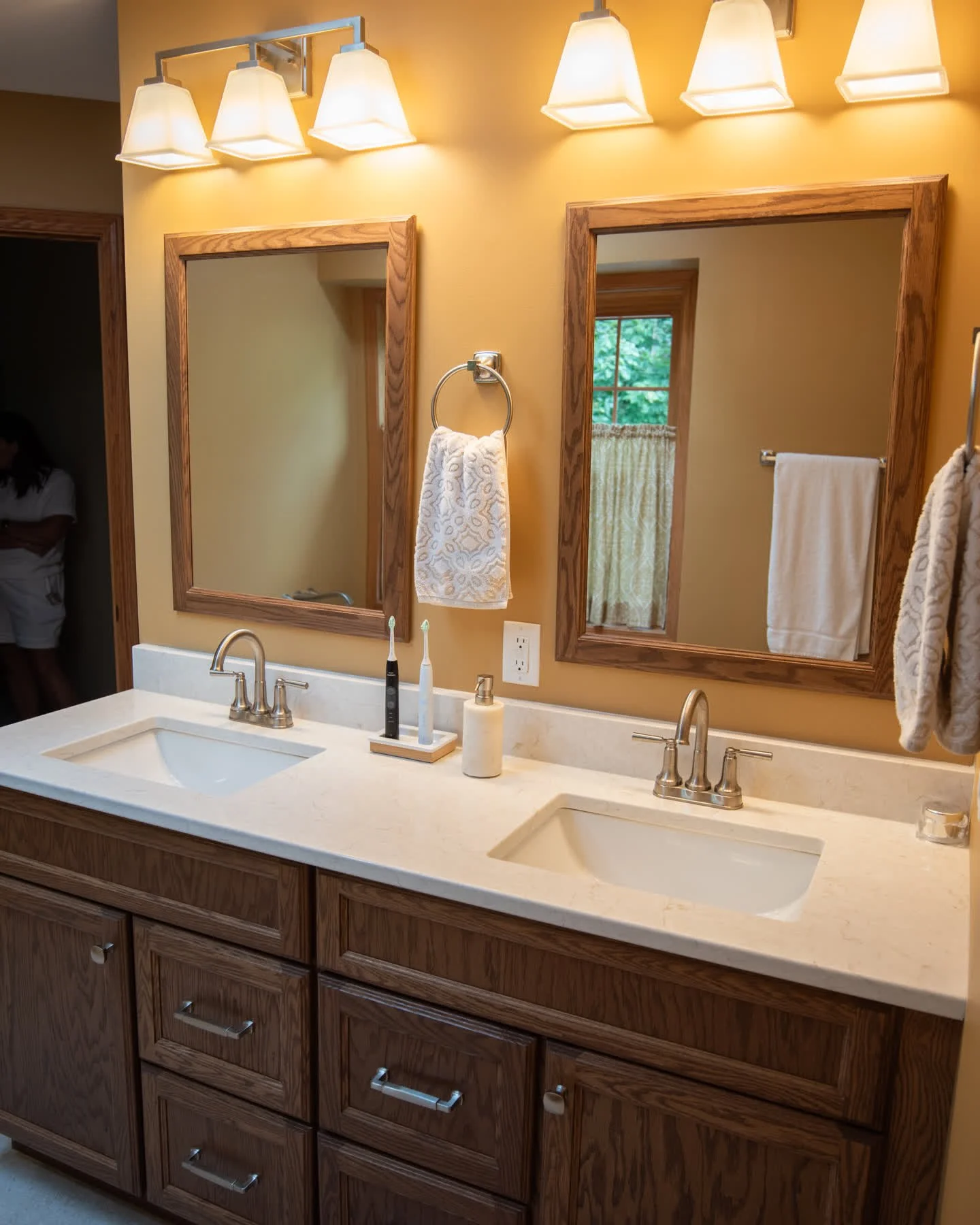 Fresh, functional, and full of style ✨ 

This bathroom transformation took an awkward angled vanity and turned it into a streamlined space with added storage thanks to a new wall and closet. We swapped the old built-in tub for a freestanding one, enl