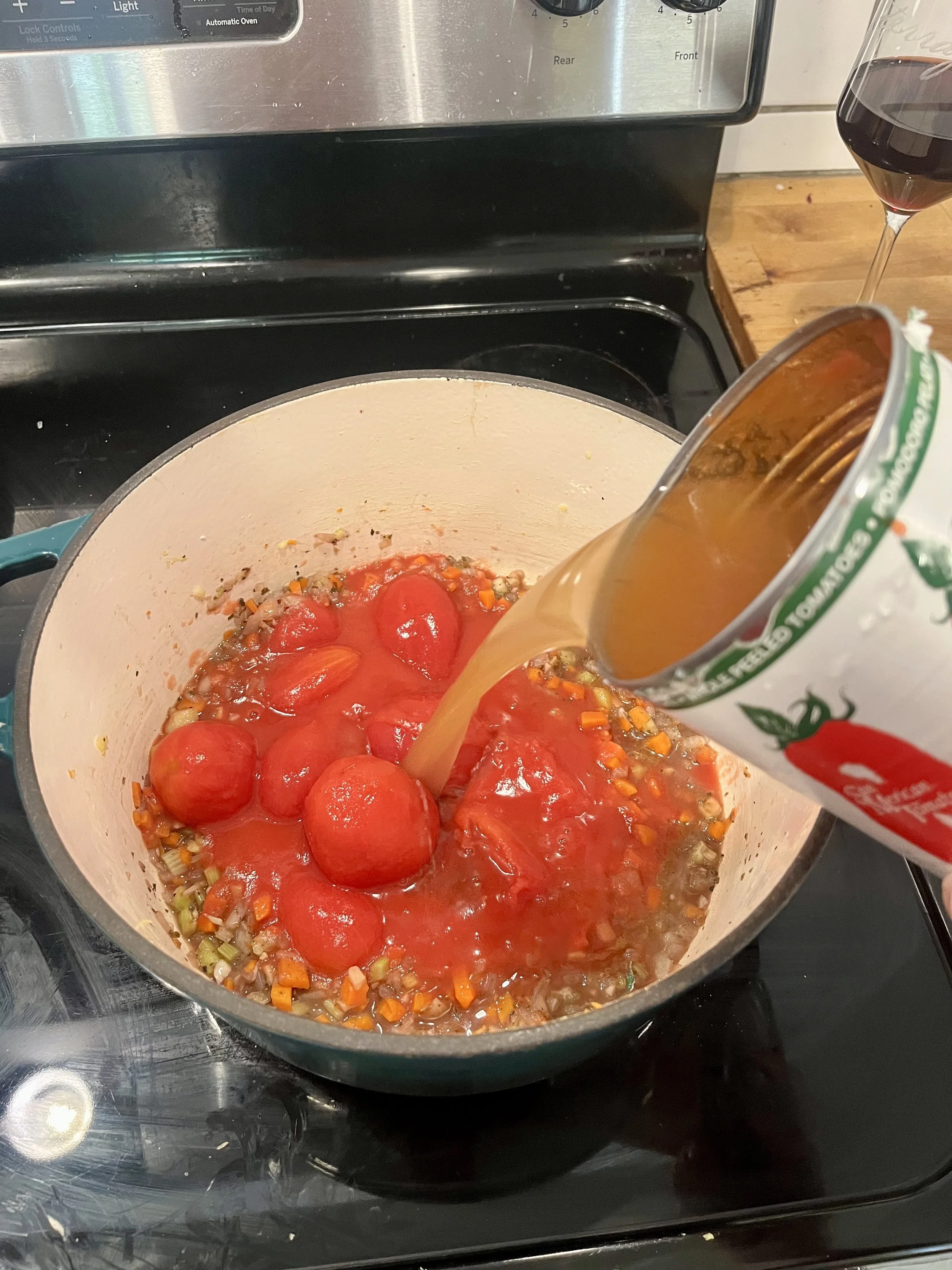 Whole Peeled Tomatoes and Homemade Vegetable Stock Added to the Pot for the Leftover Ragu with Mendocino Ridge Pinot Noir 