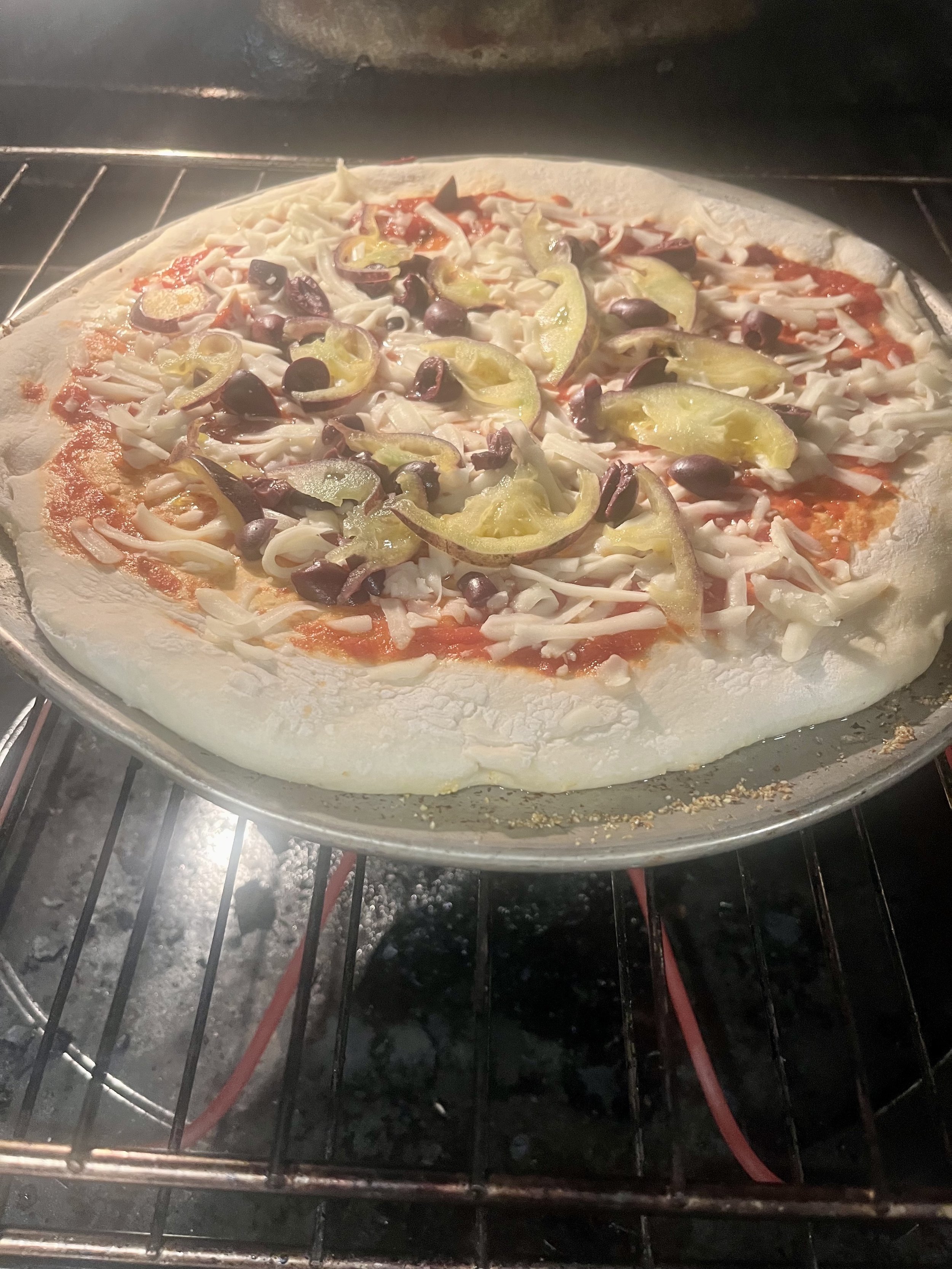 Red Sauce Pizza with Mozzarella Cheese, olives and tomatoes for Terragena Wine 