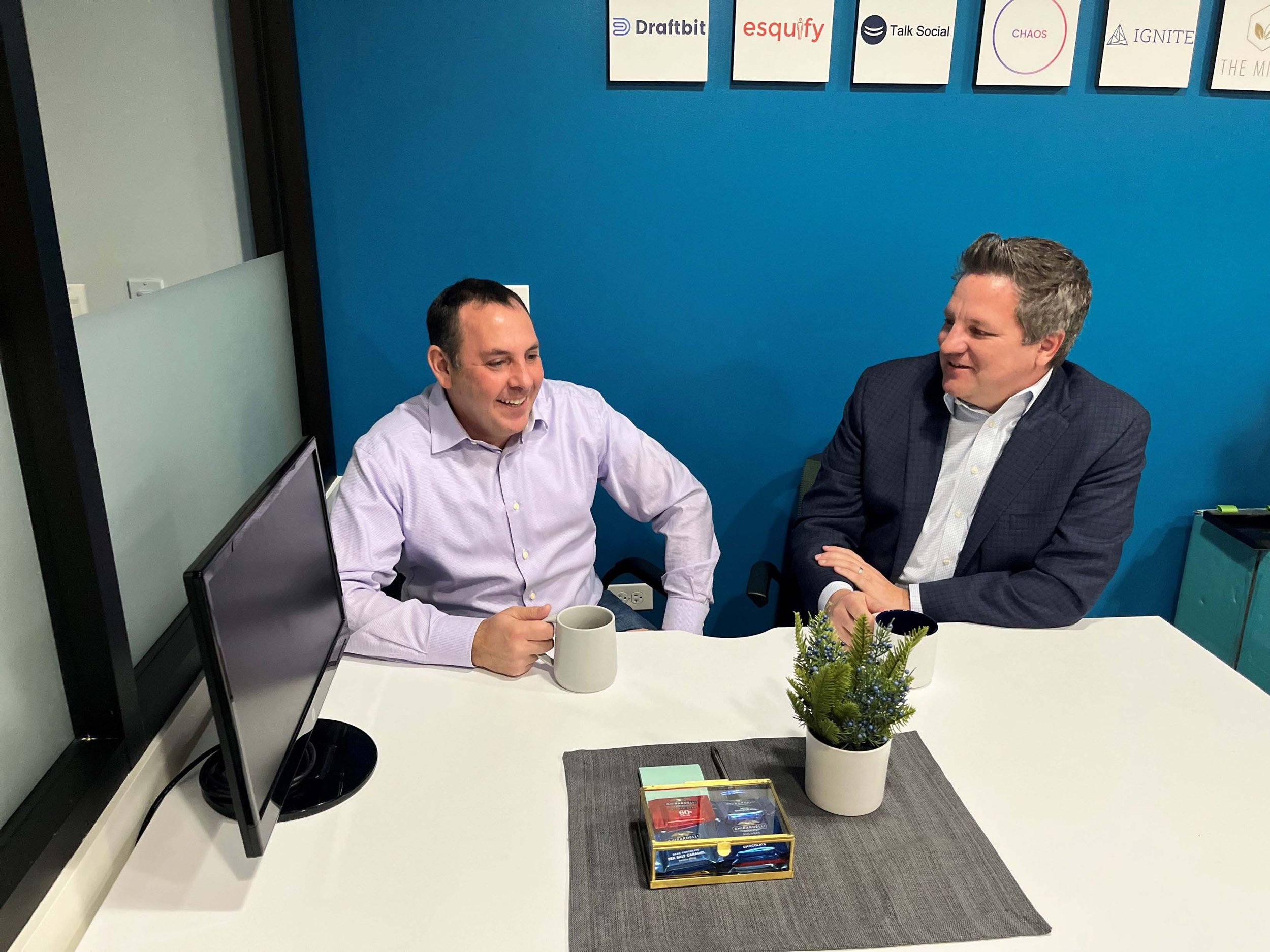 Jeff of Network Ventures talking with a Founder at the Network Ventures office in Chicago