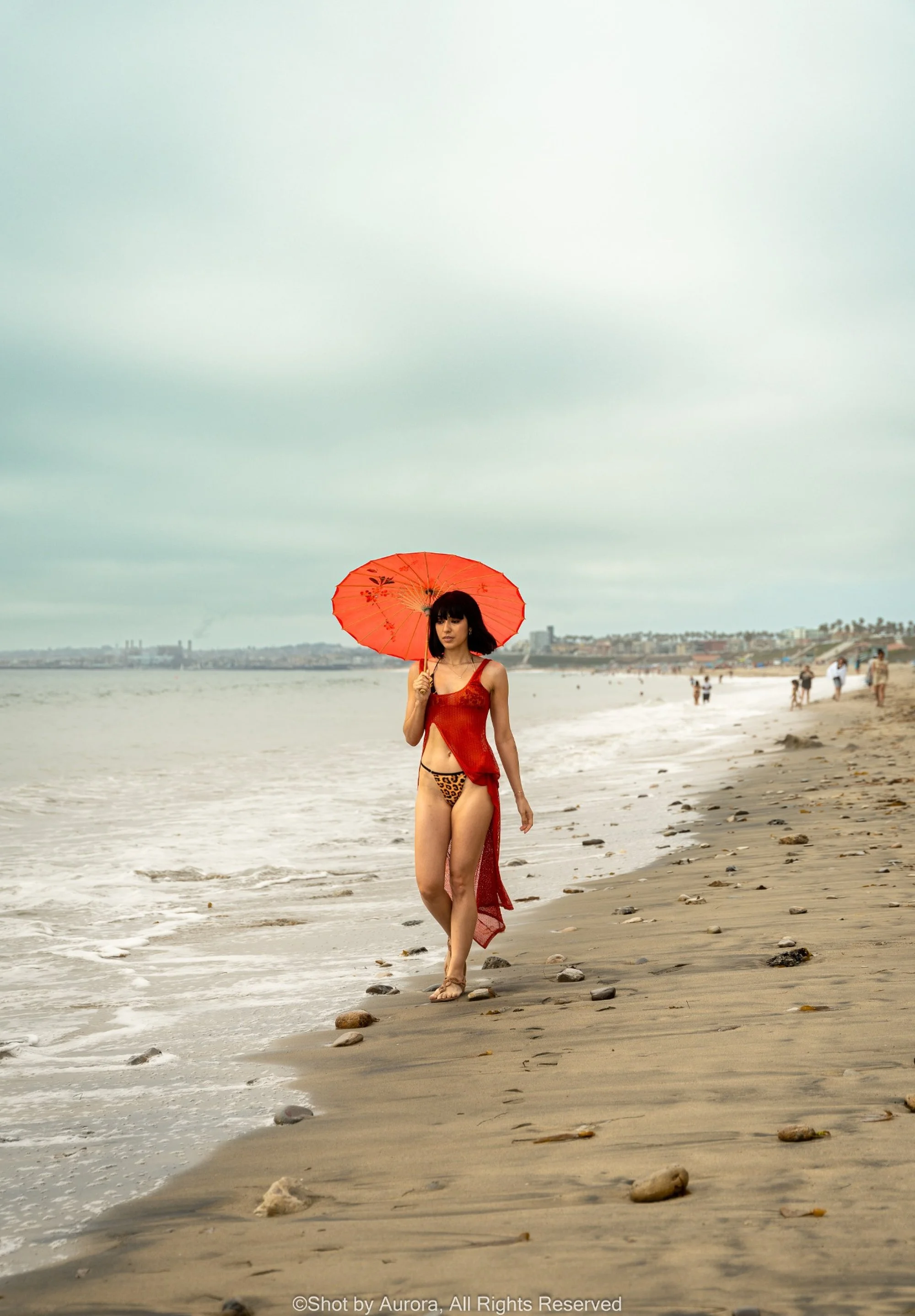 beach-fashion-portrait-red-parasol-by-aurora.jpg
