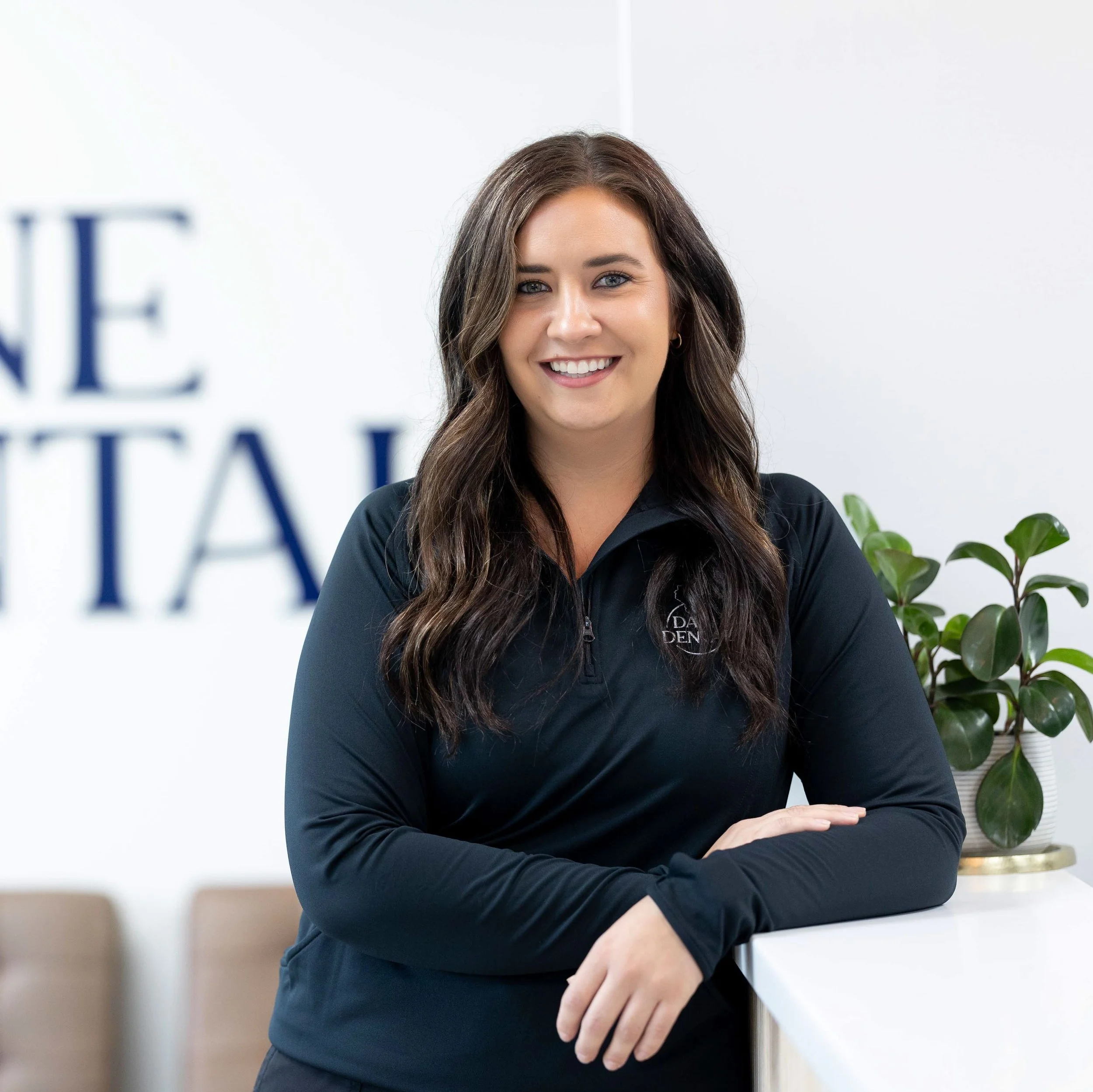 Molly - Dental assisting posing in front office of Dane Dental McFarland