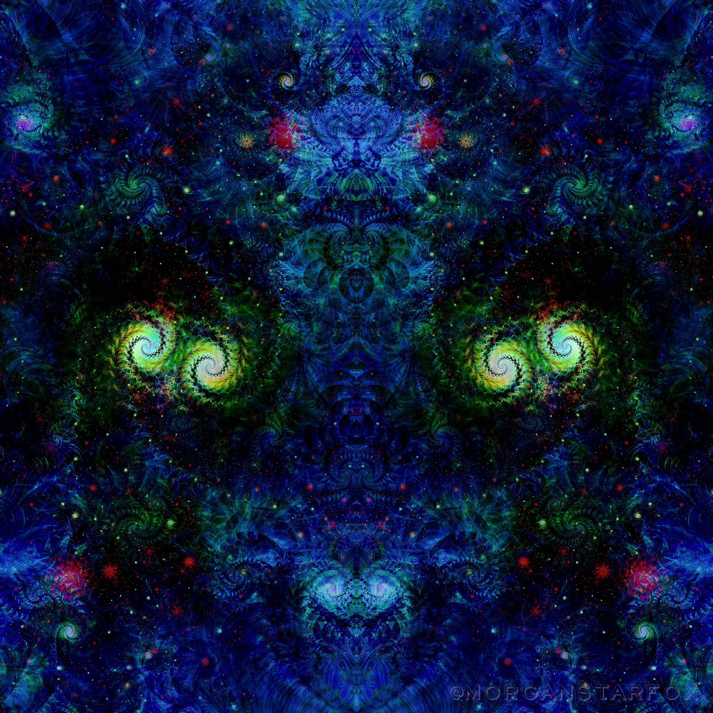 A vibrant, intricate fractal pattern with swirling designs in shades of blue, green, red, and yellow, resembling a cosmic or galaxy-like scene.