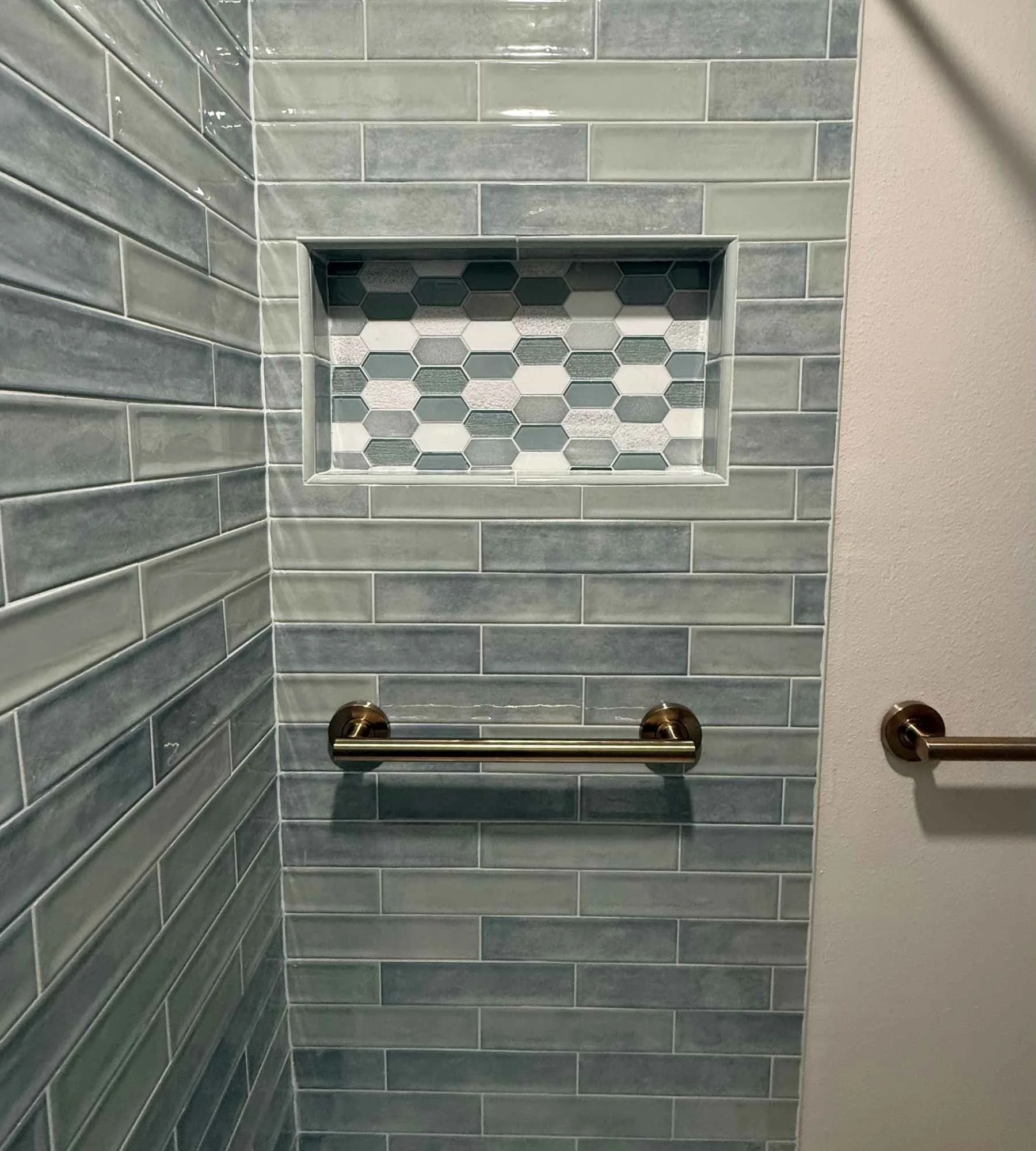 design-build-kitchen-renovation-gulf-breeze-fl-bathroom-design-for-aging-in-place-blue-tile-shower-with-grab-bars-timeless.jpg