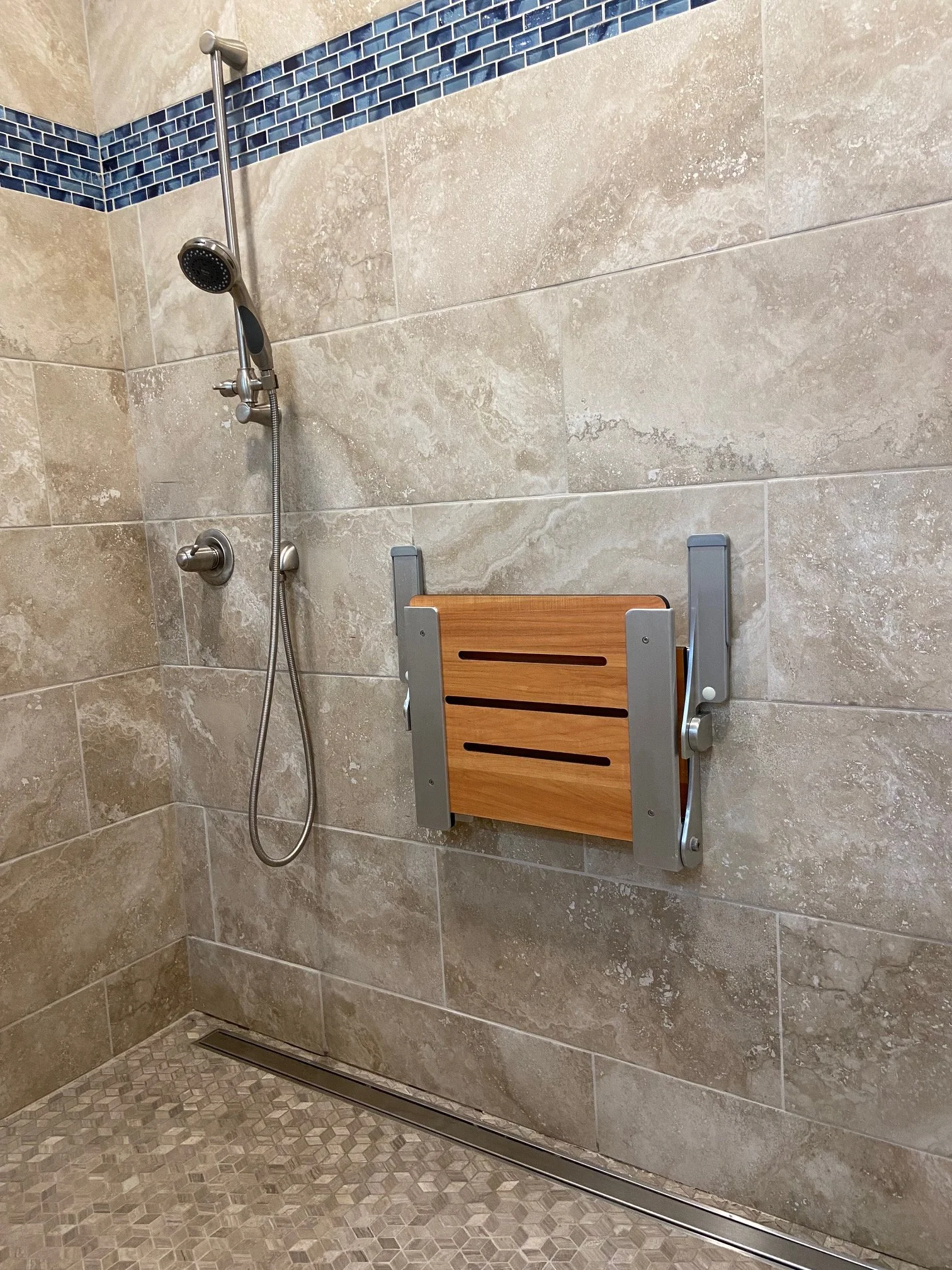 ckd-remodeling-milton-fl-bathroom-design-for-aging-in-place-fold-down-shower-bench-hand-held-shower-head-neutral-colors-fresh.jpg